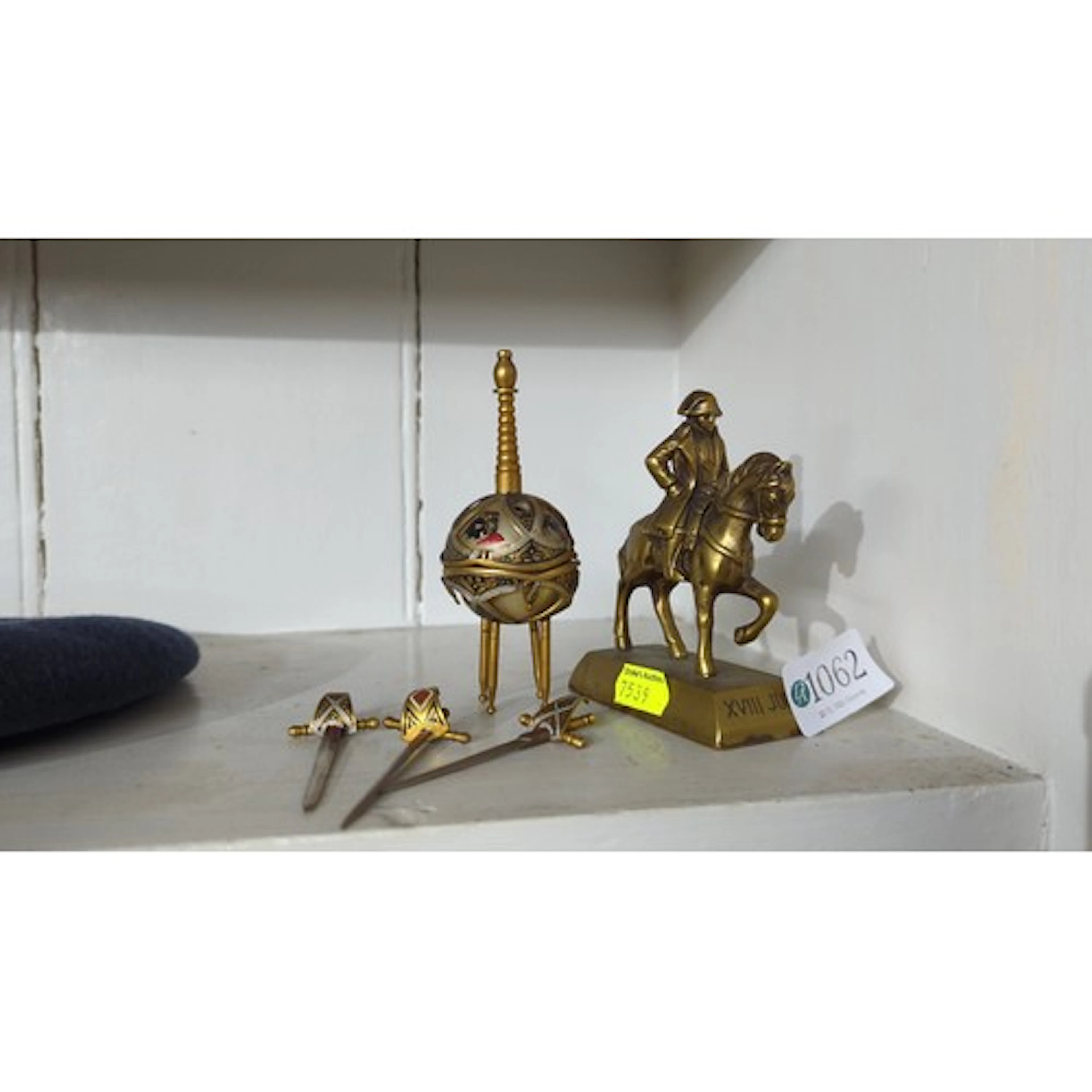A group of gilt-metal desk ornaments, including a Napoleonic...
