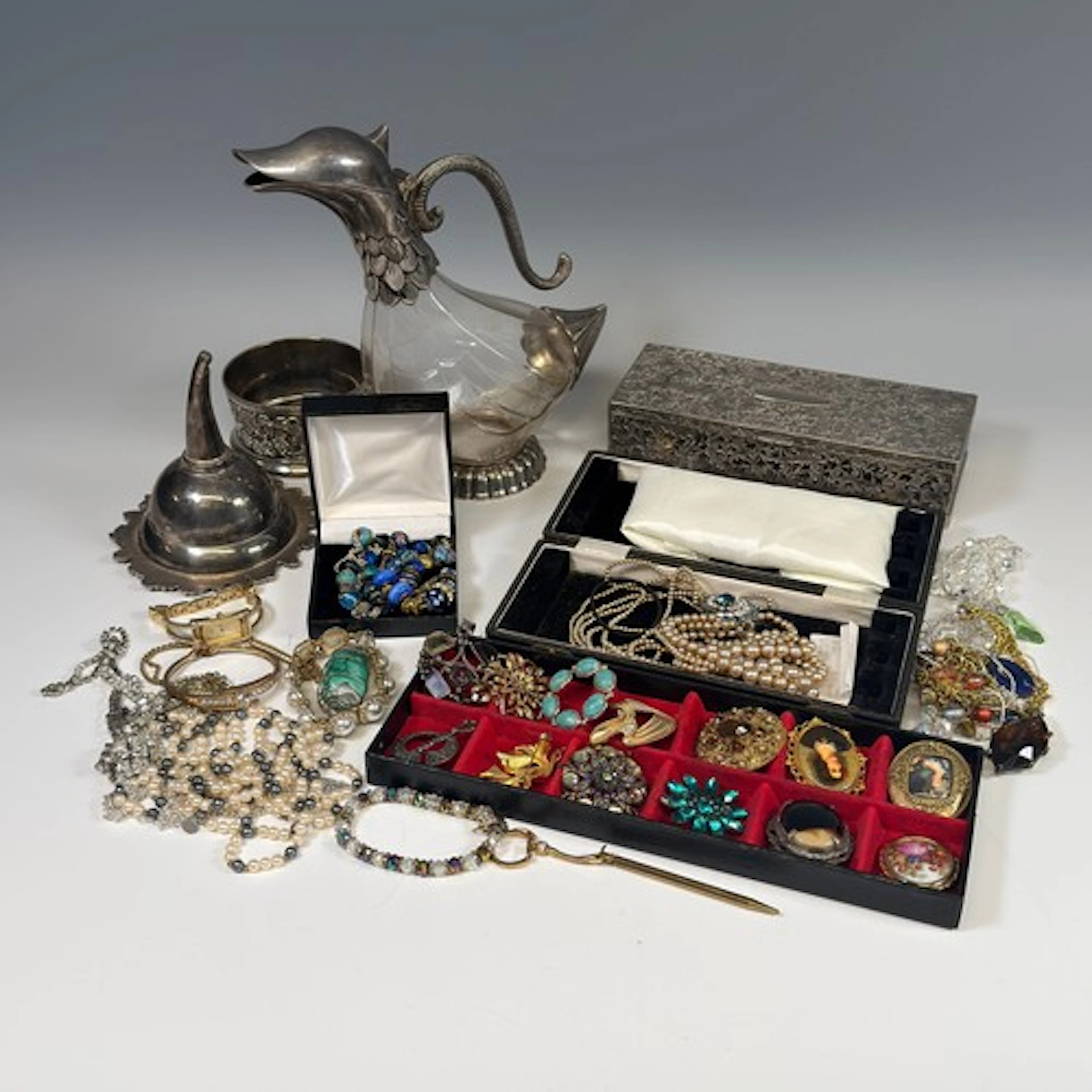 A quantity of Costume Jewellery, including a silver bracelet...