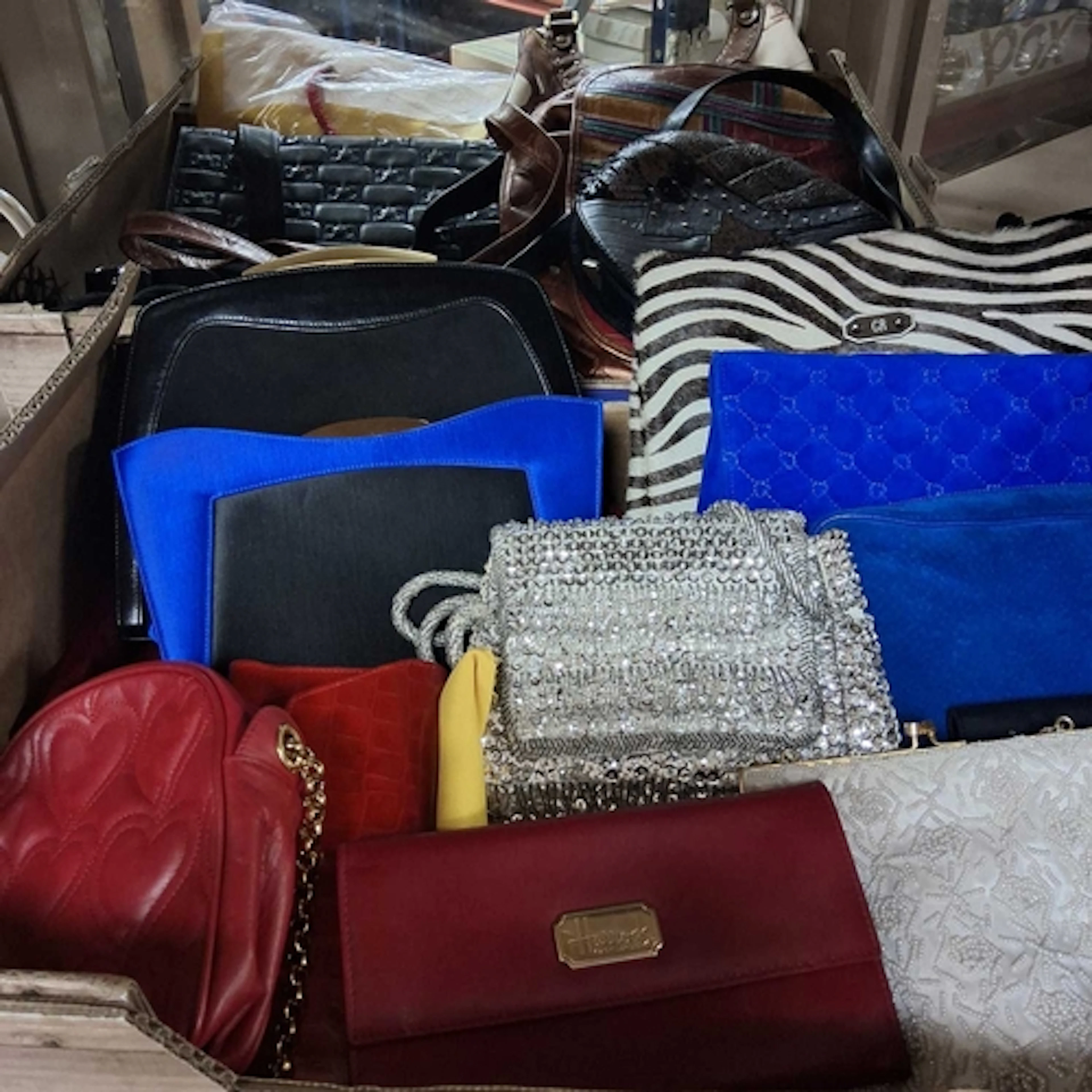 TWO BOXES OF LADIES' HANDBAGS, to include a Georges Rech zeb...