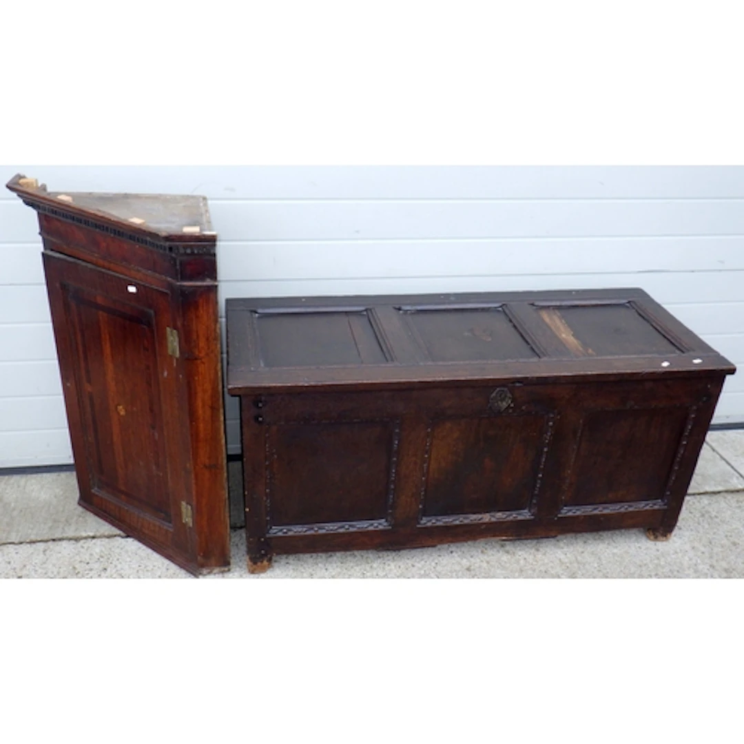 A Geo III oak hanging corner cupboard together with a three ...