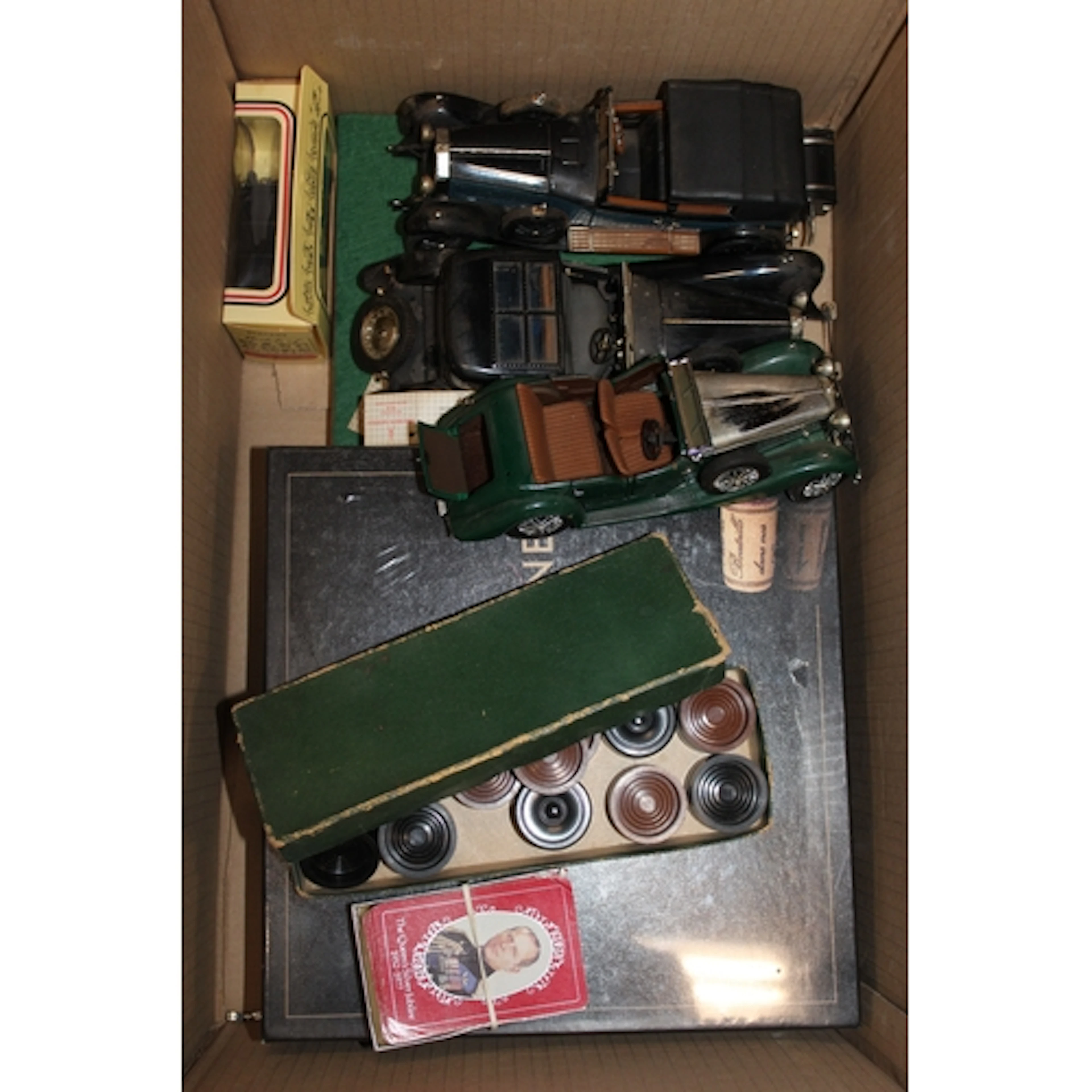 Box containing World of Wine board game, model cars, draught...