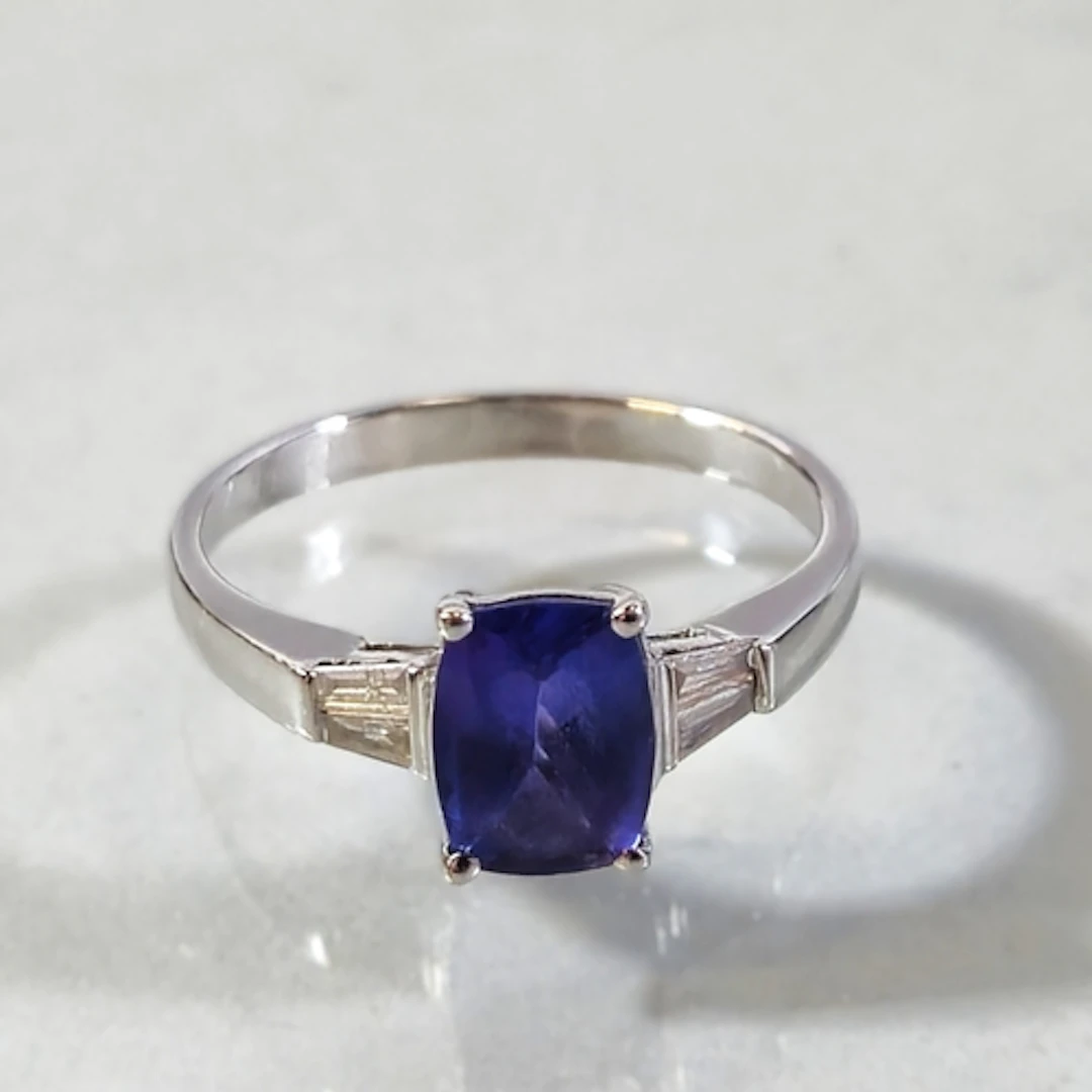 14k white gold tanzanite and diamond ladies ring, set with a...