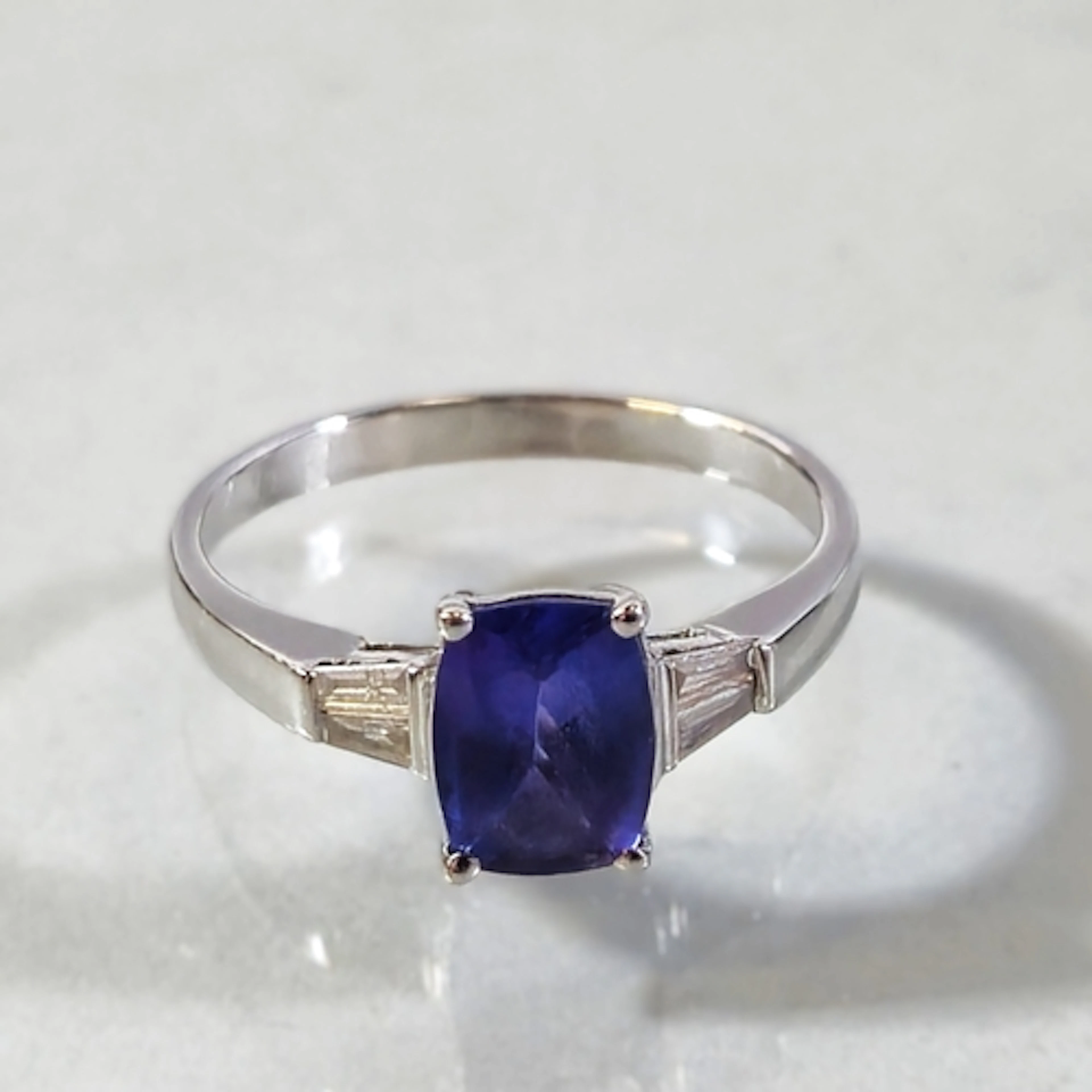 14k white gold tanzanite and diamond ladies ring, set with a...