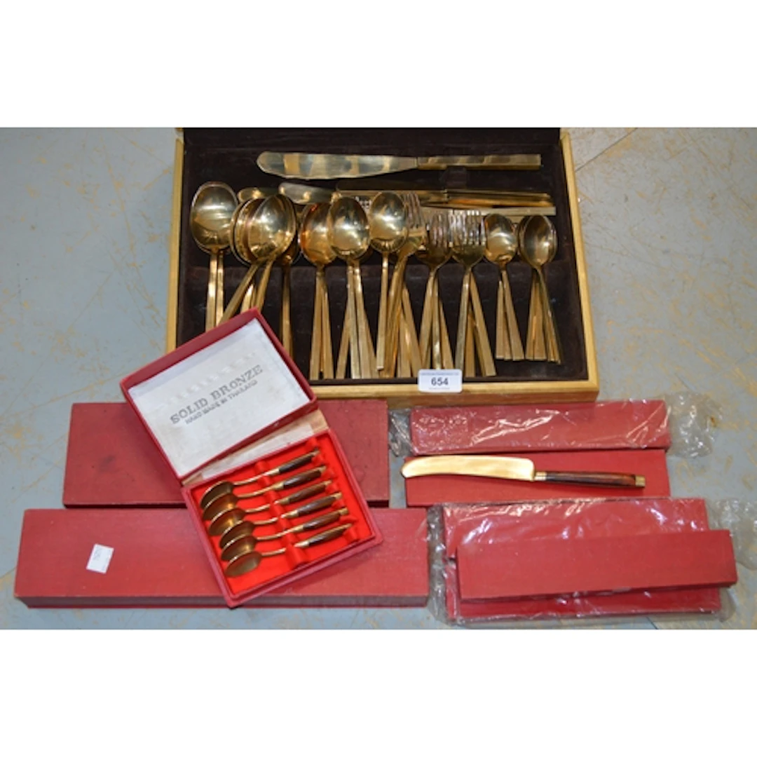 Quantity of Mid 20th Century bronze cutlery, in a wooden cas...
