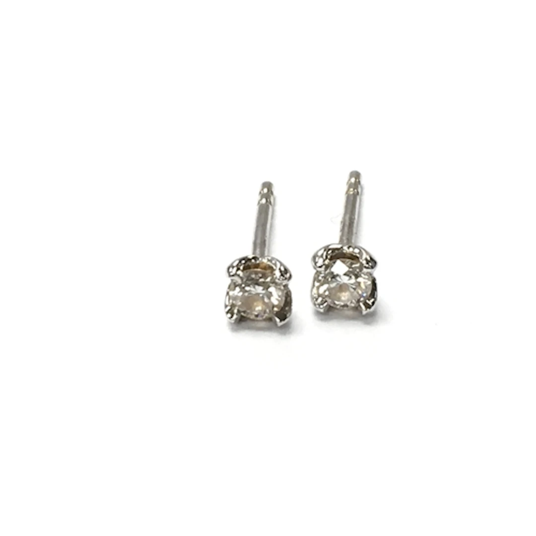 A pair of 18ct whote gold diamond stud earrings. Approx 0.08...