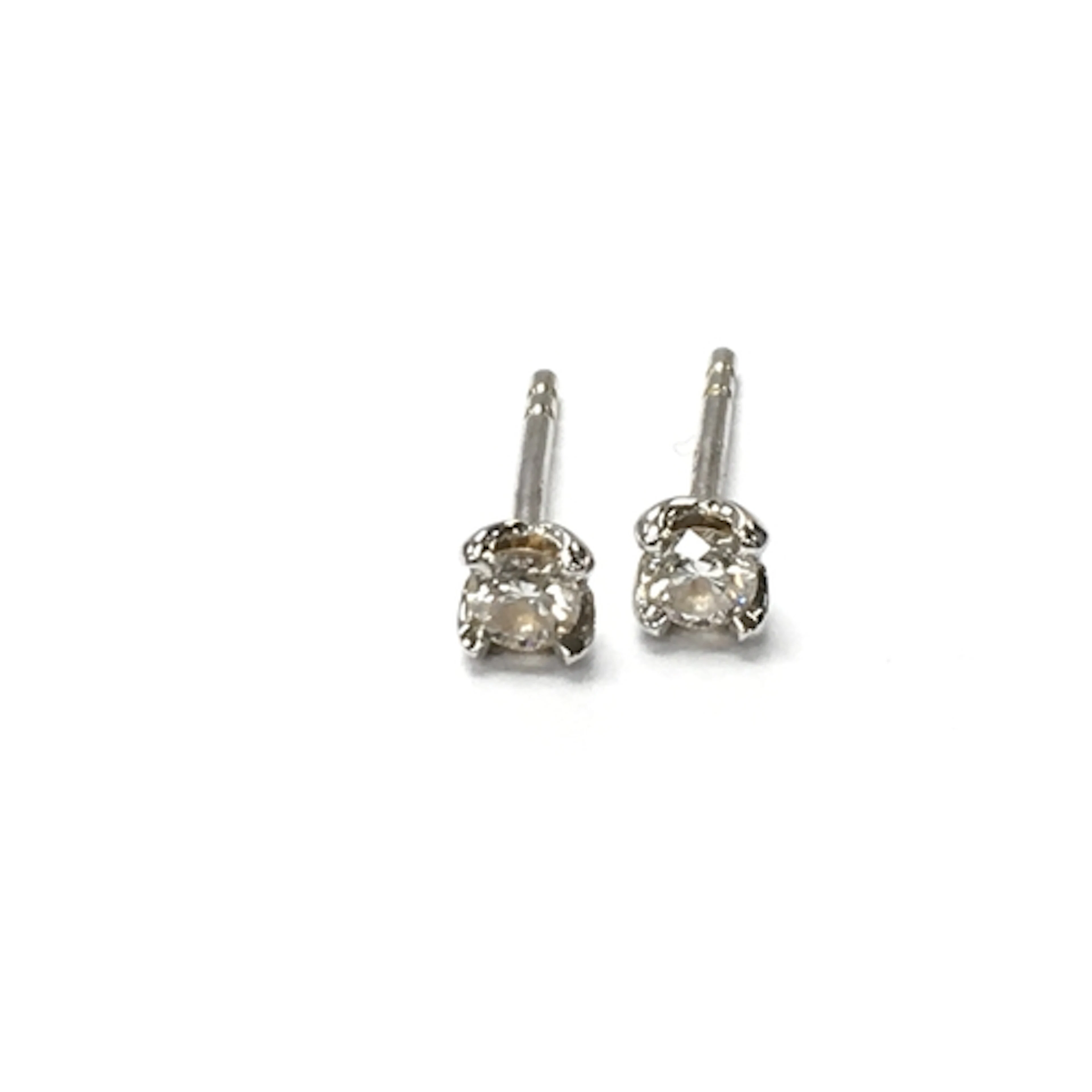 A pair of 18ct whote gold diamond stud earrings. Approx 0.08...