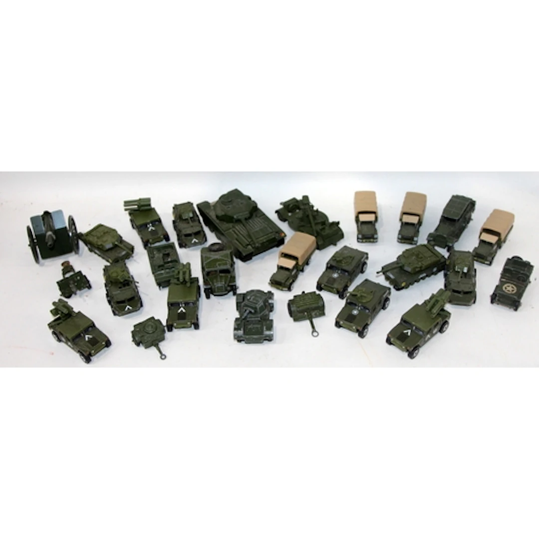 A collection of die-cast military vehicles including Dinky