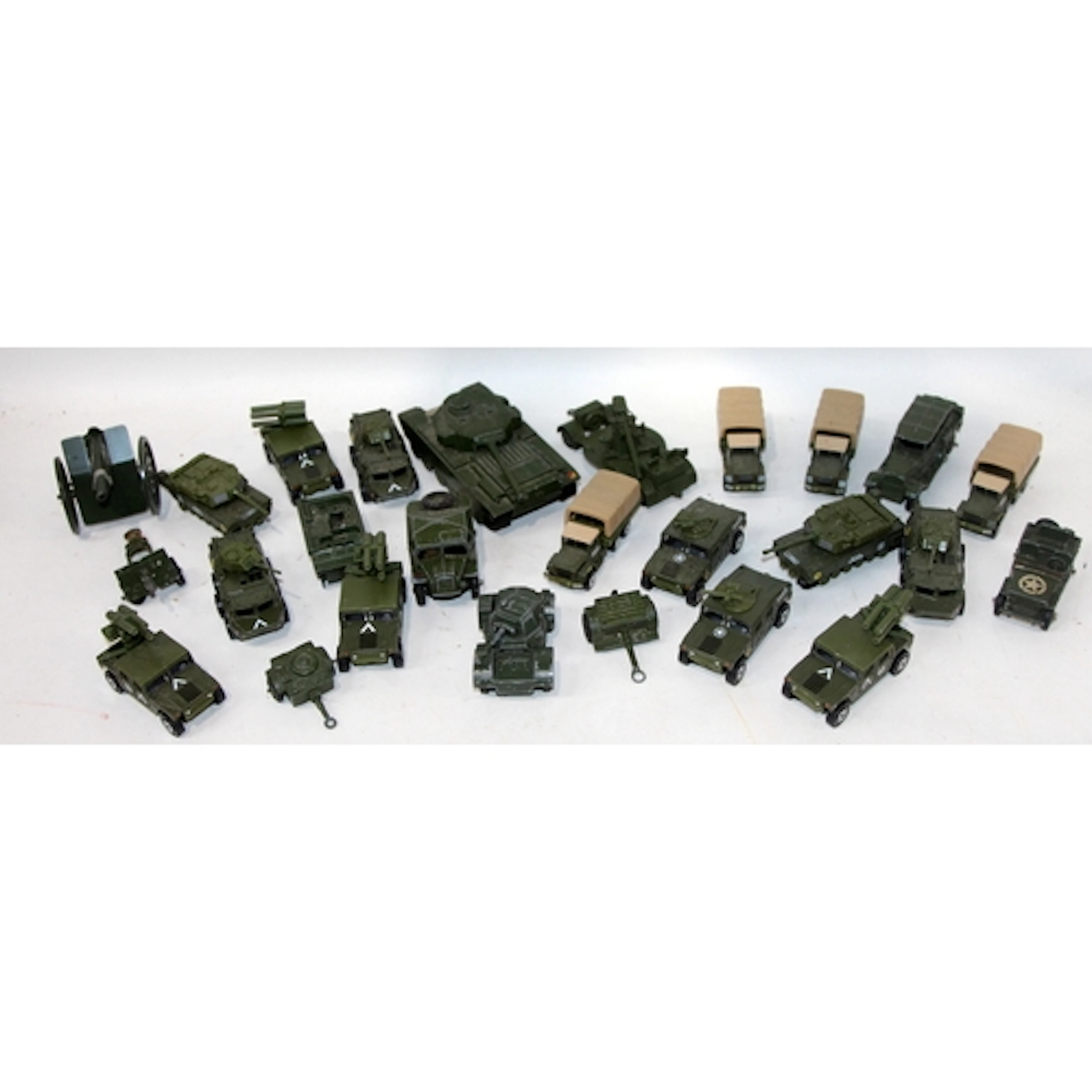 A collection of die-cast military vehicles including Dinky