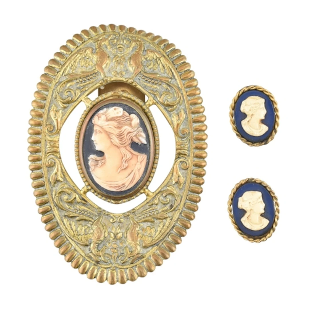 A French cameo dress clip and a pair of cameo clip on earrin...