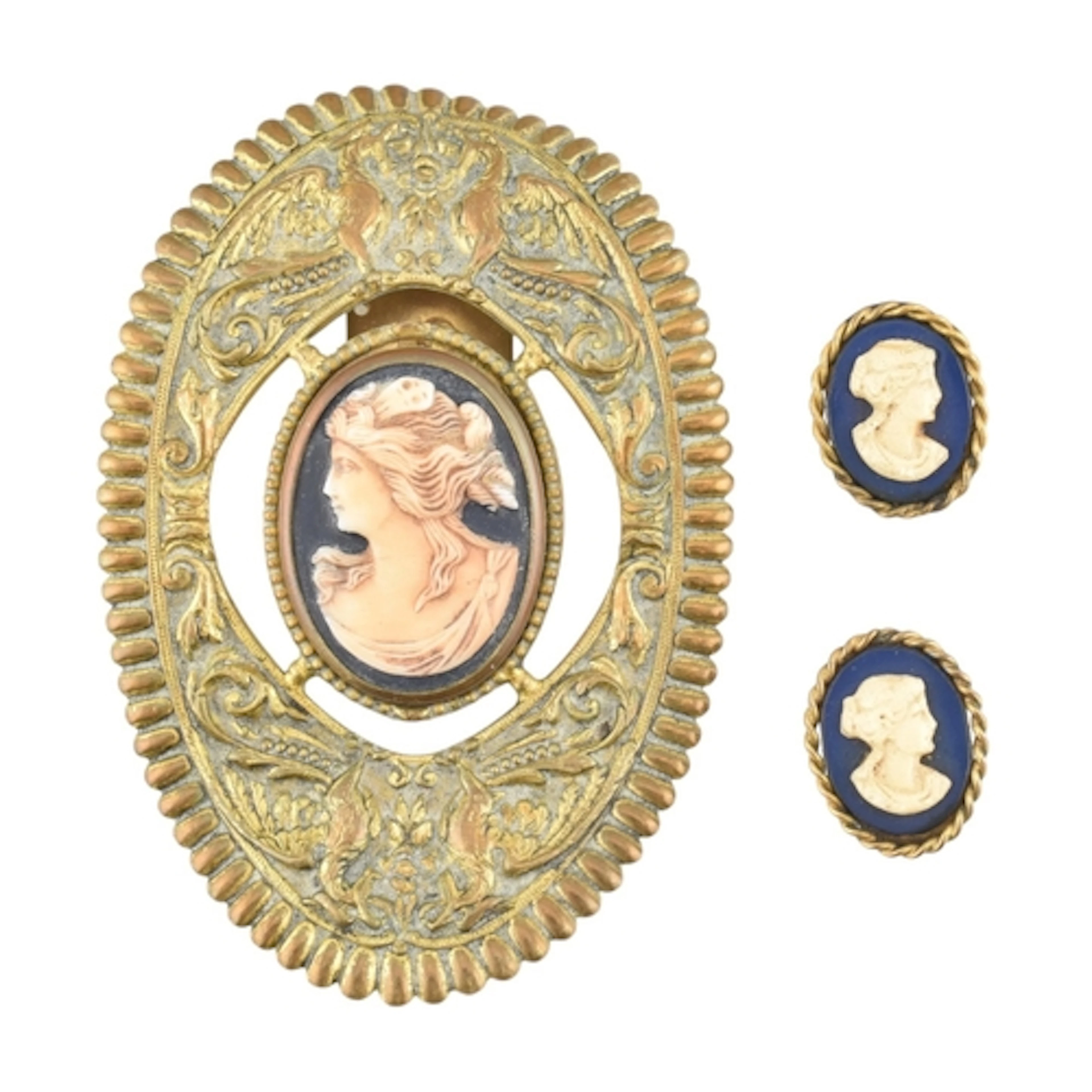 A French cameo dress clip and a pair of cameo clip on earrin...