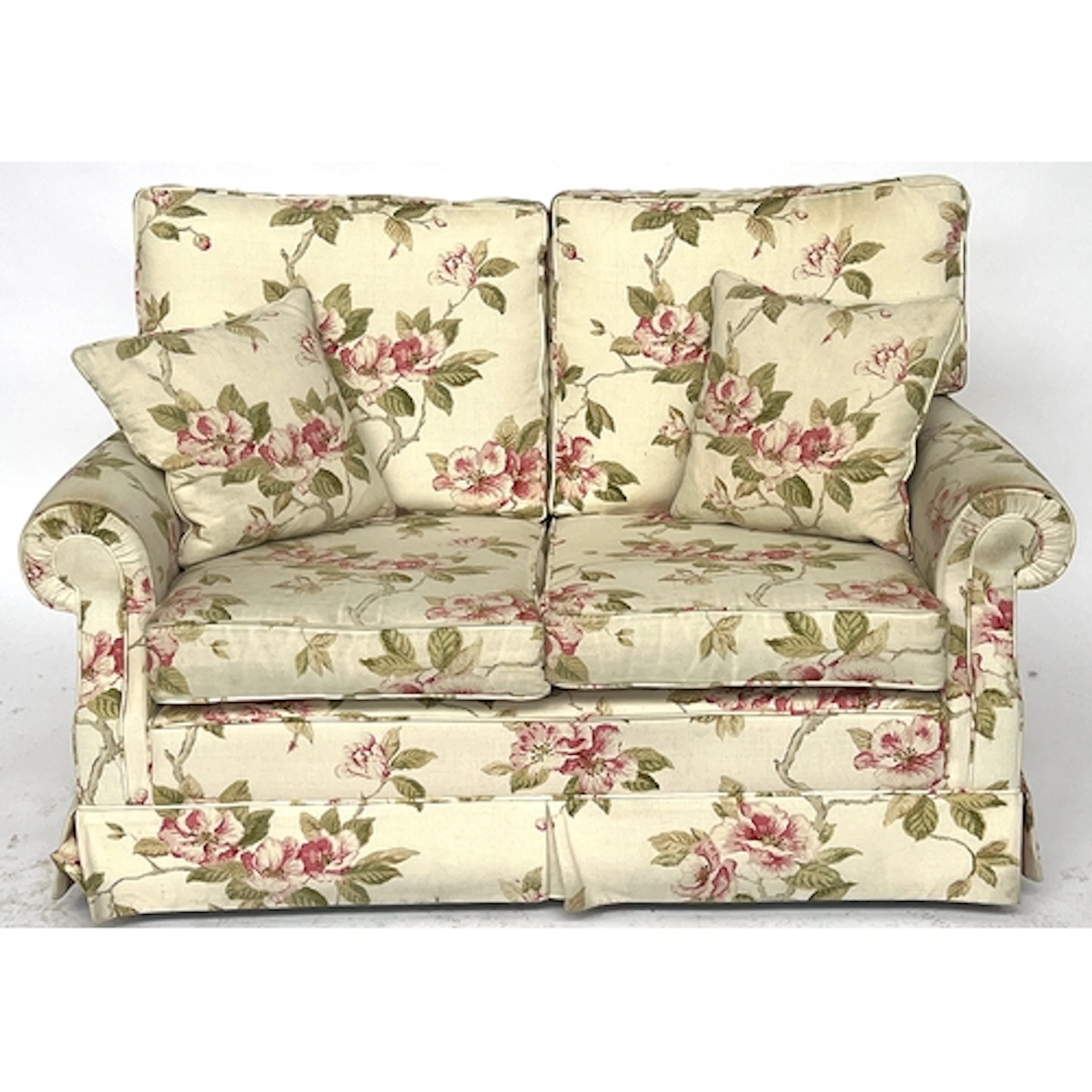 A modern two seater sofa in a pink floral print, 136cm wide