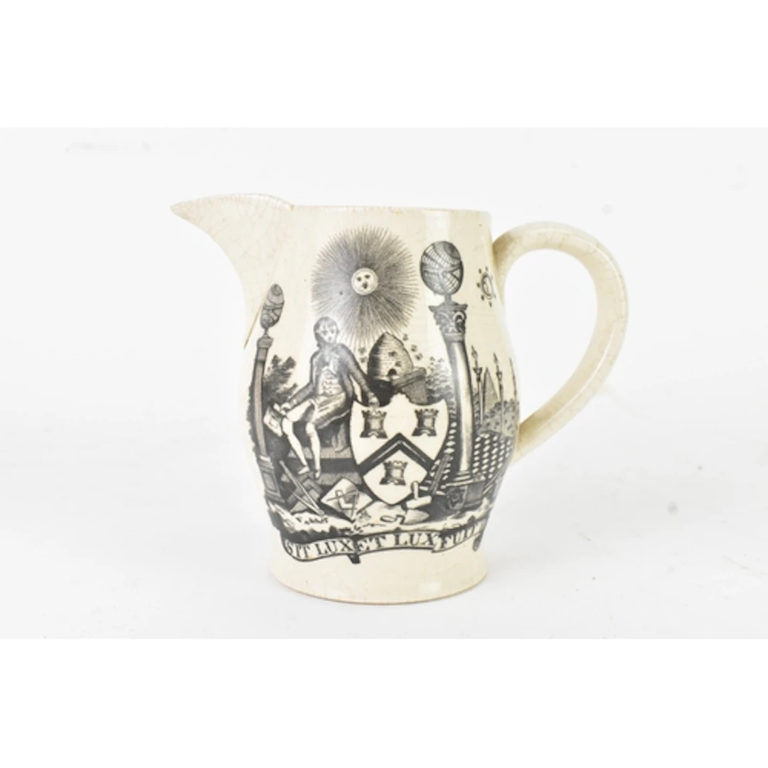 A19th century Masonic creamware jug, transfer-printed in bla...