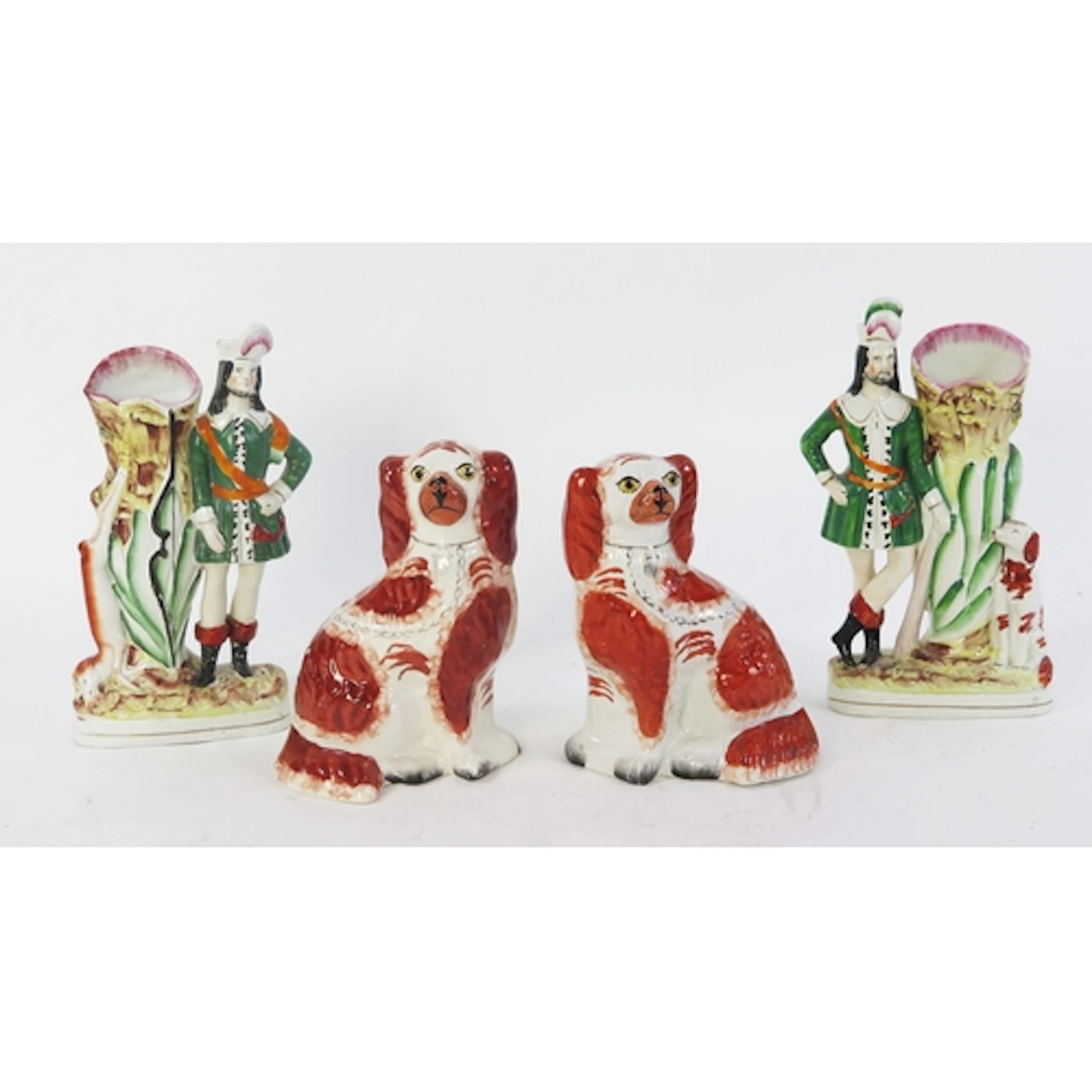 A pair of Staffordshire King Charles Spaniels, with orange o...