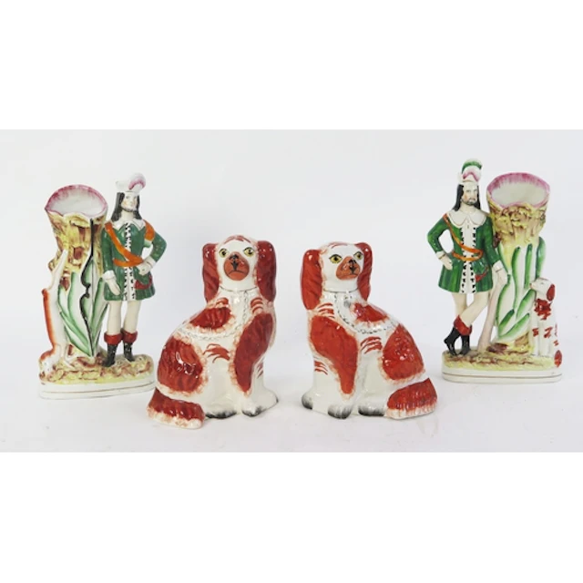 A pair of Staffordshire King Charles Spaniels, with orange o...