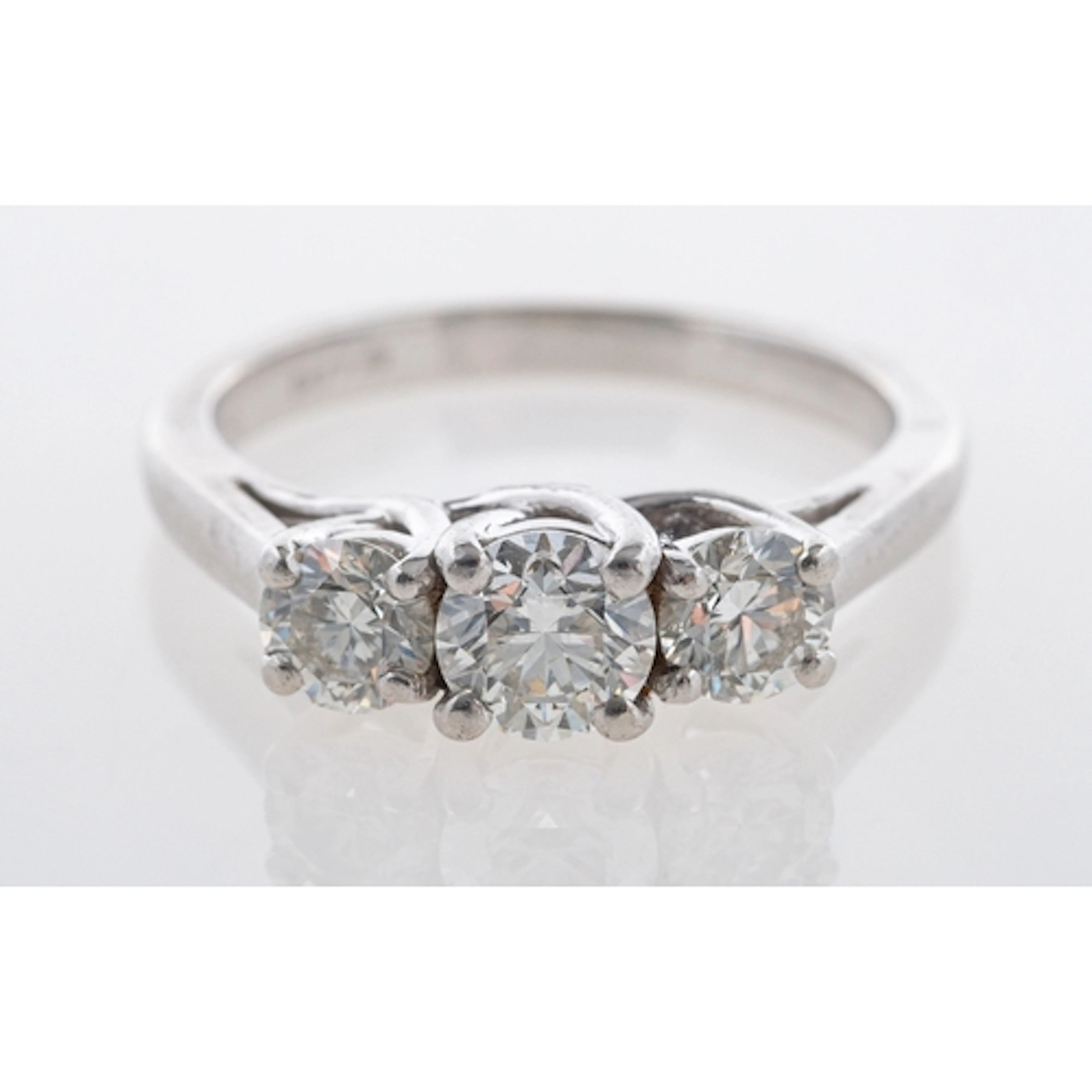 A diamond trilogy ring, the classic crossover tiffany style ...