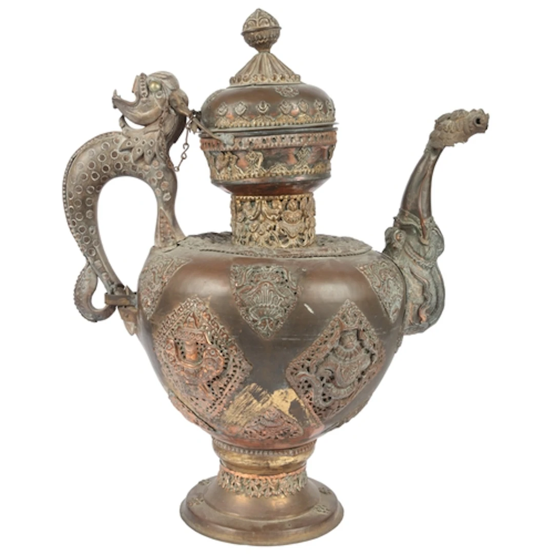 A massive Tibetan brass and copper repoussé work teapot, lat...