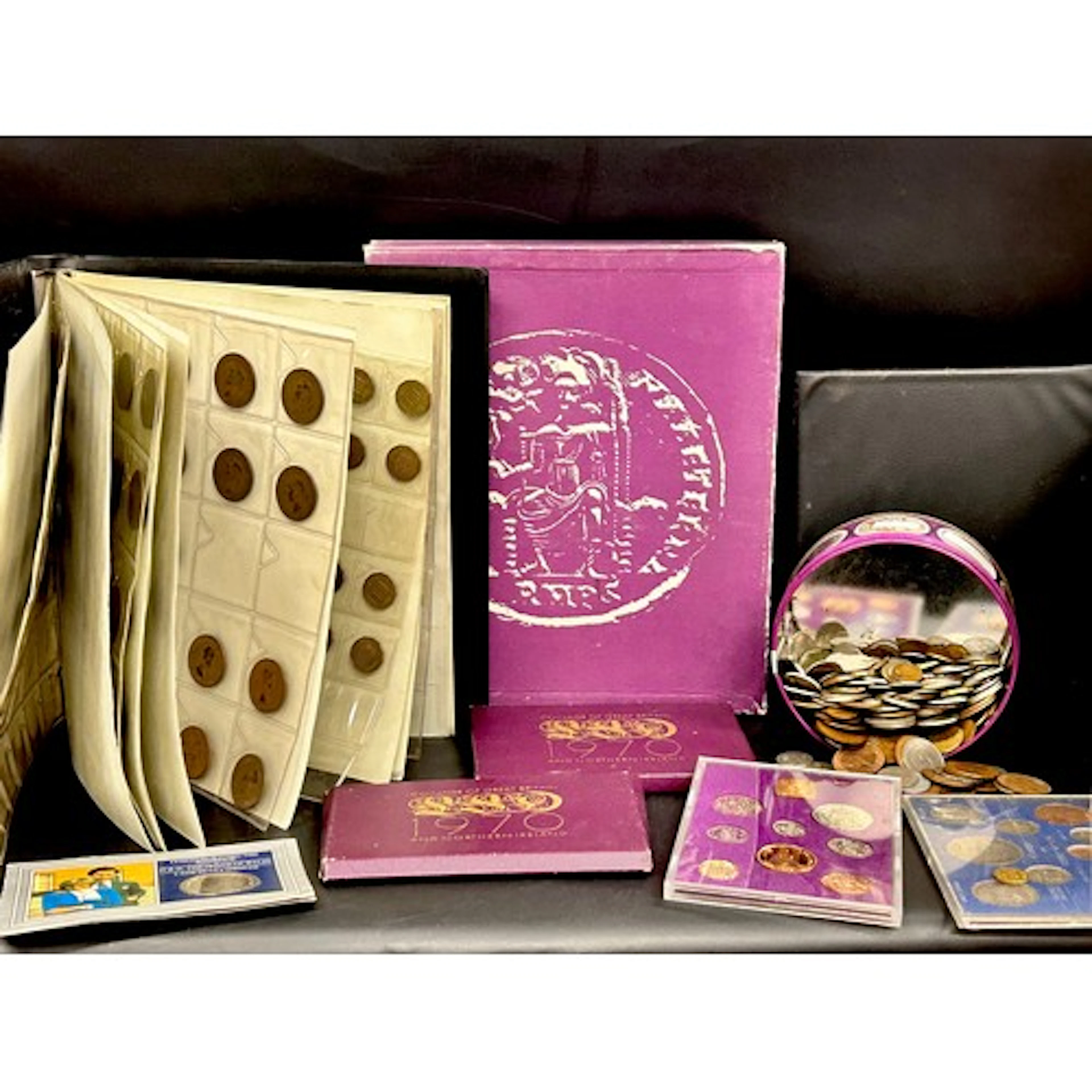 A coin album of mixed coinage, tin of mixed coins, Papua New...