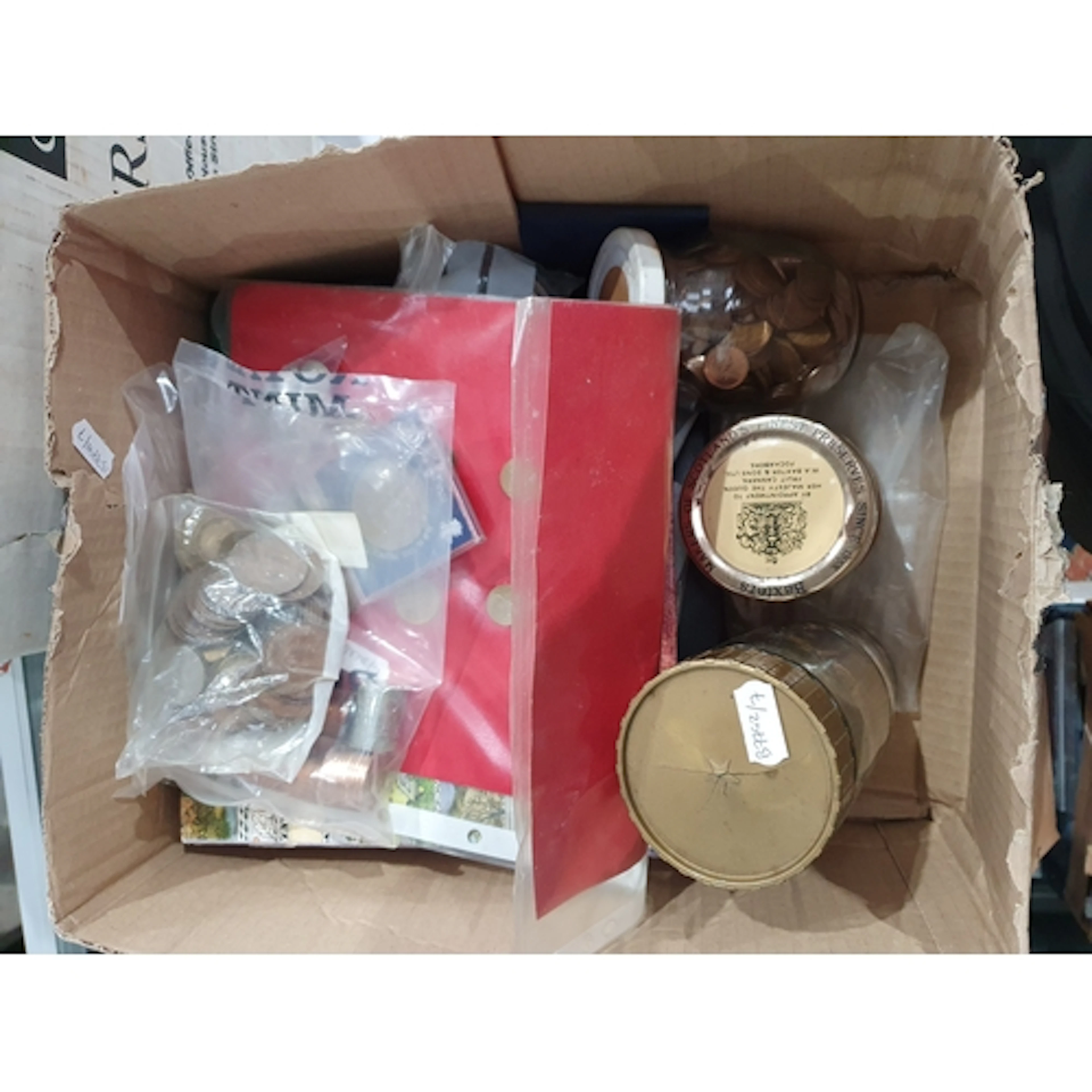 A box of British and World Coins, to include a small quantit...