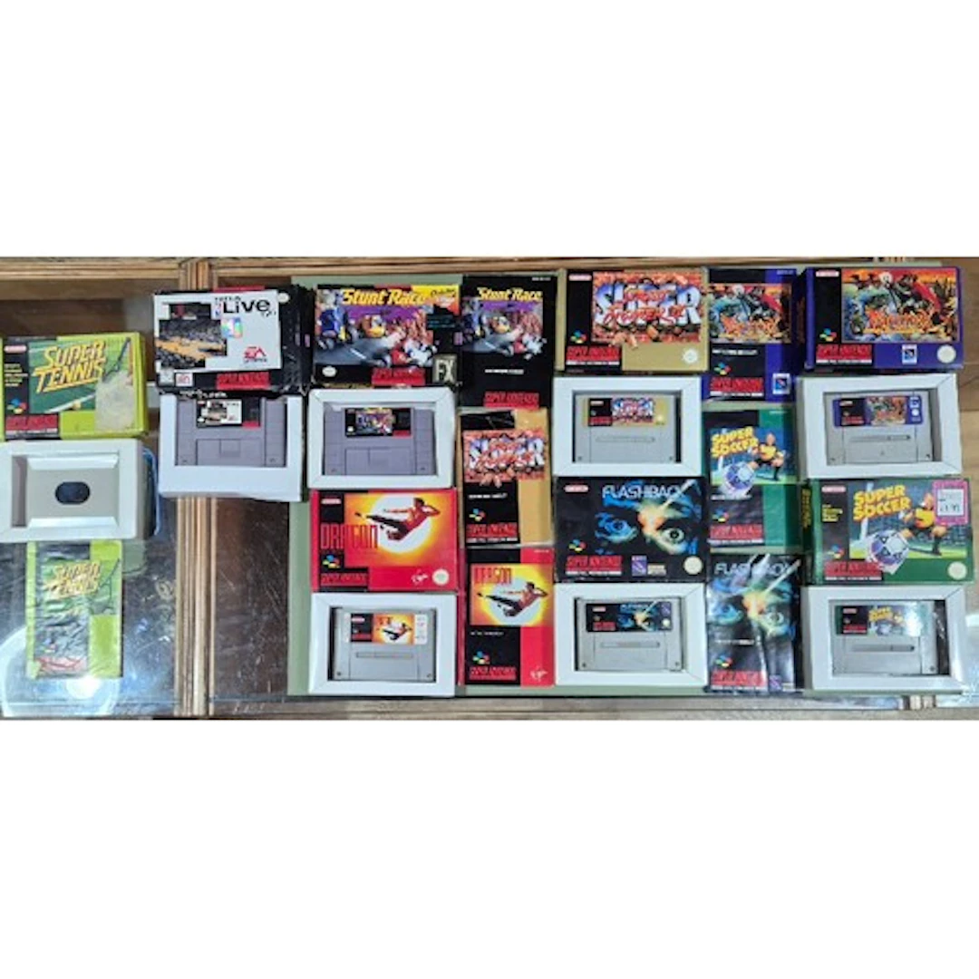 A box of assorted SNES games to include Super Soccer, Equino...