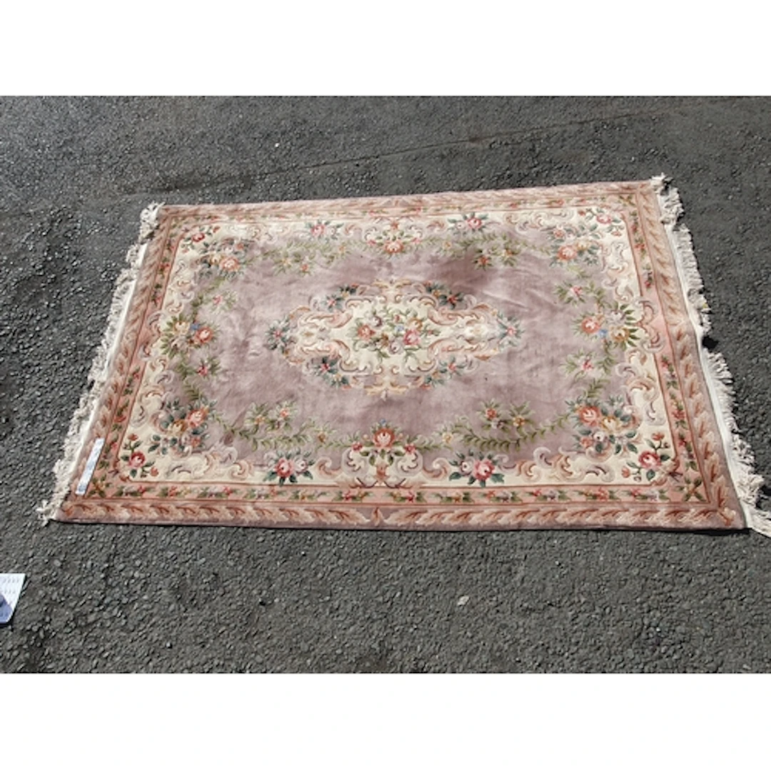 A Chinese style Rug with floral border and central floral mo...
