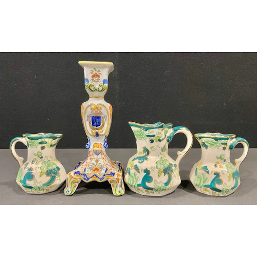 A hand painted armourial crested candlestick, possibly Frenc...
