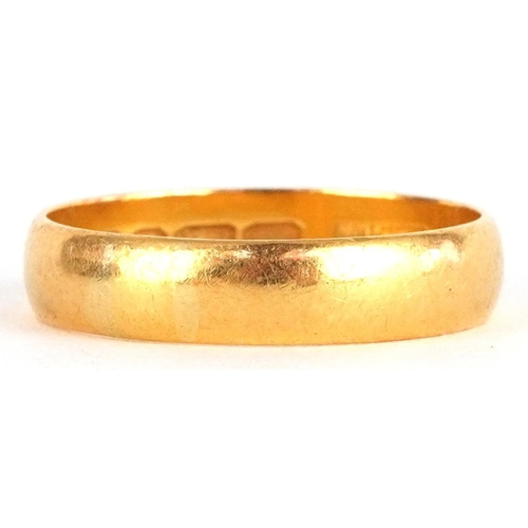 22ct gold wedding band, London 1969, size X/Y, 6.8g.