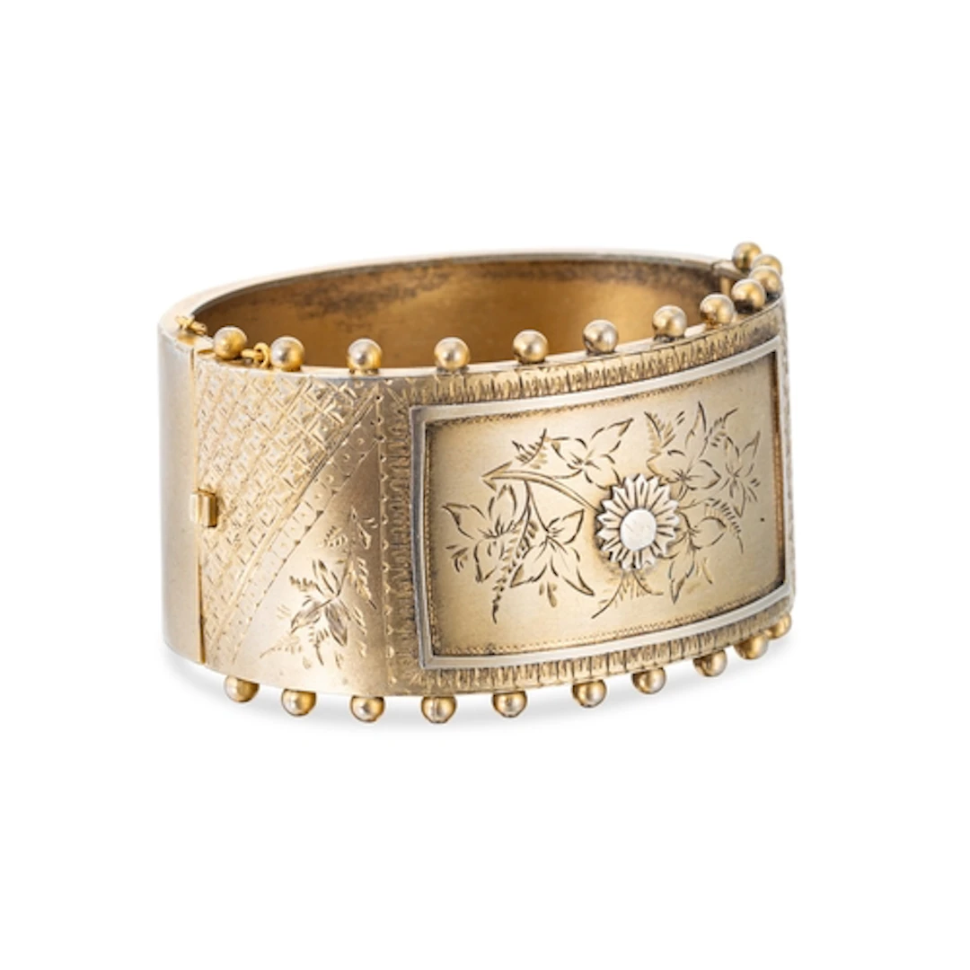A LATE VICTORIAN SILVER GILT CUFF BANGLE, floral and foliate...