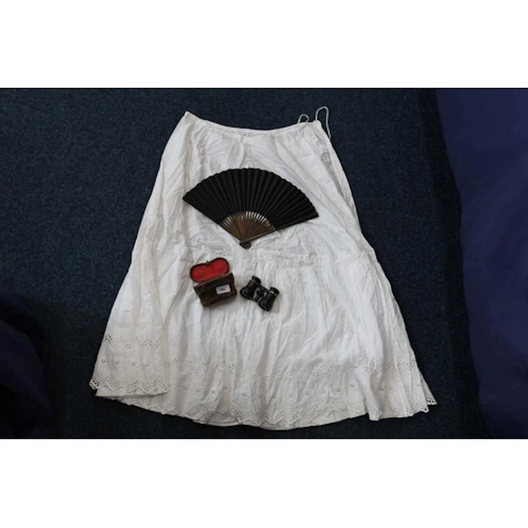 Pair of opera glasses, a fan and a nightdress.