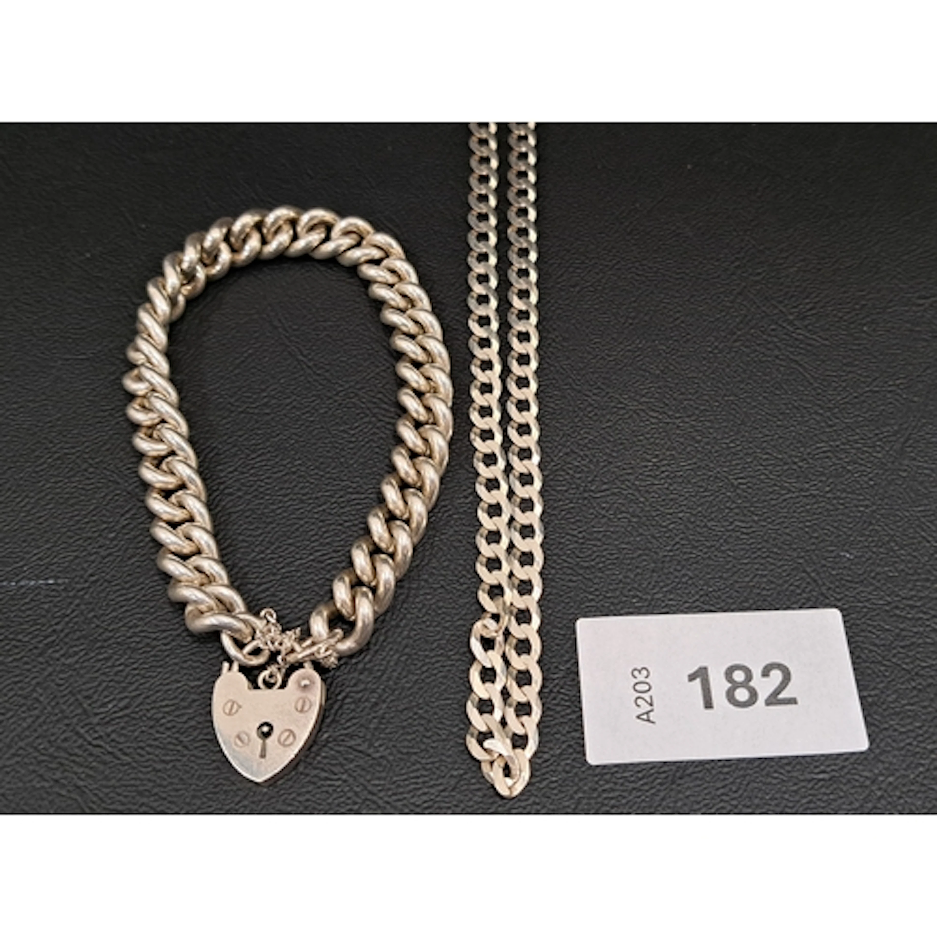 SILVER BRACELET AND A SILVER NECK CHAIN comprising a curb li...