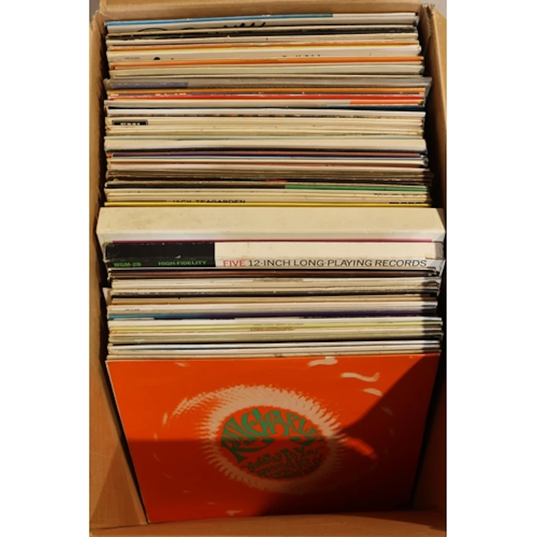 Box containing mixed jazz vinyl records, etc.