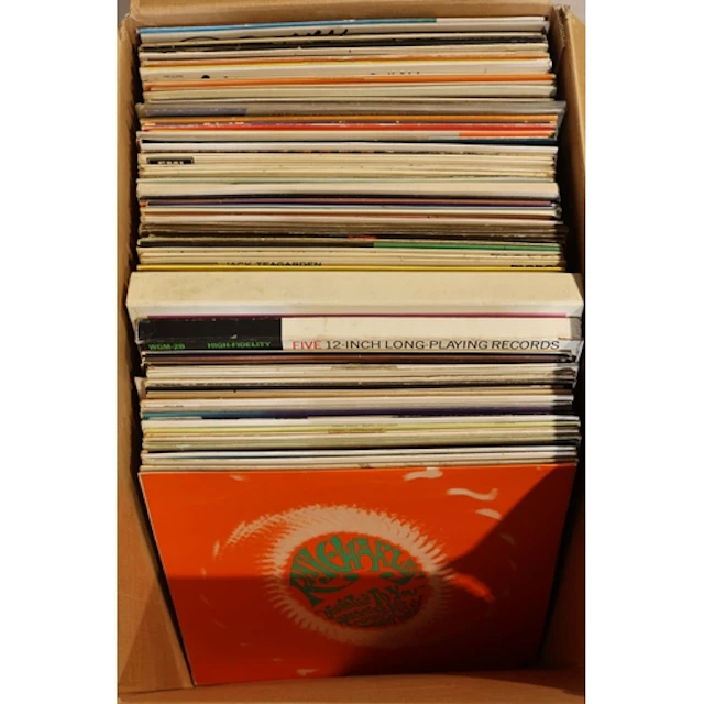 Box containing mixed jazz vinyl records, etc.