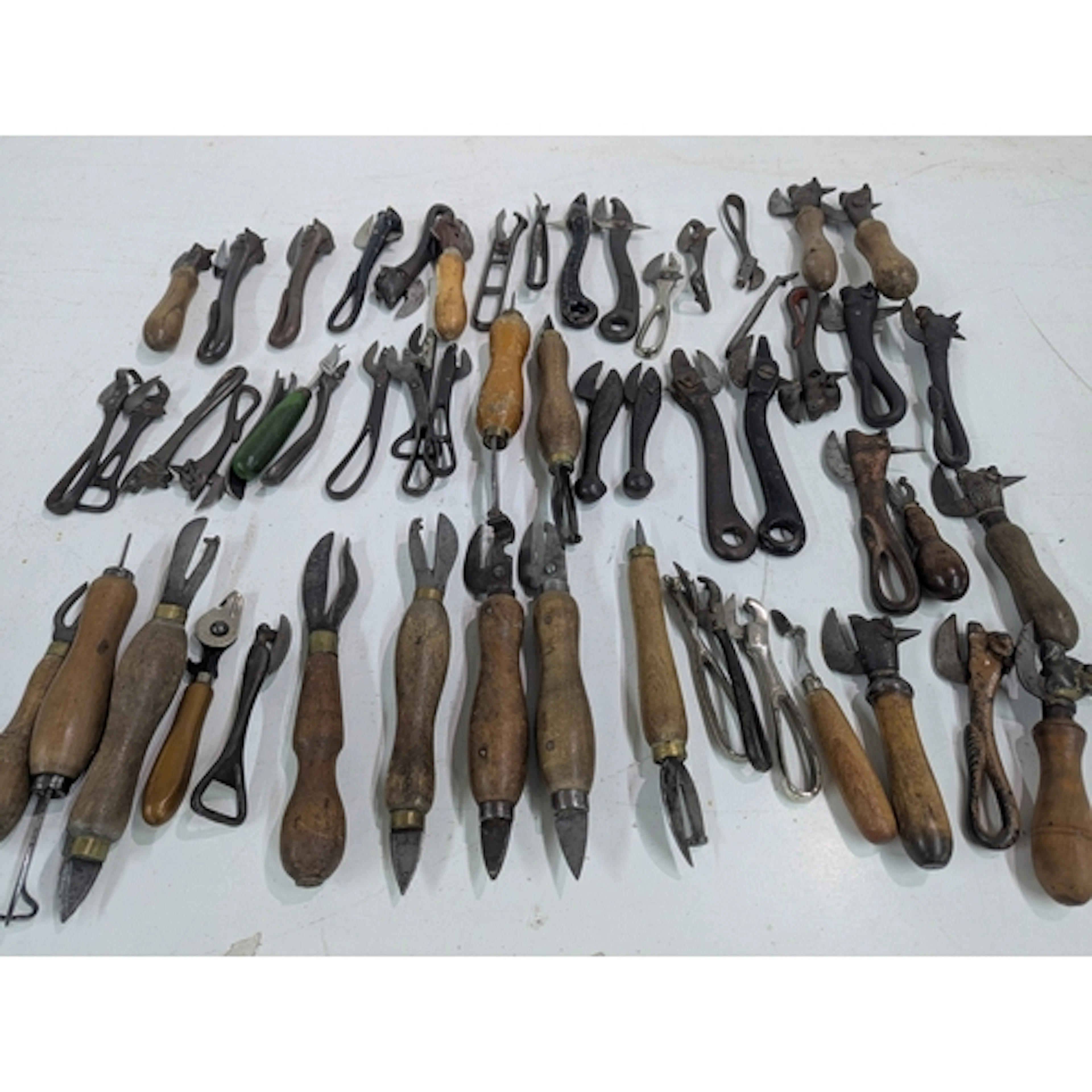 A collection of 19th century and later tin openers to includ...