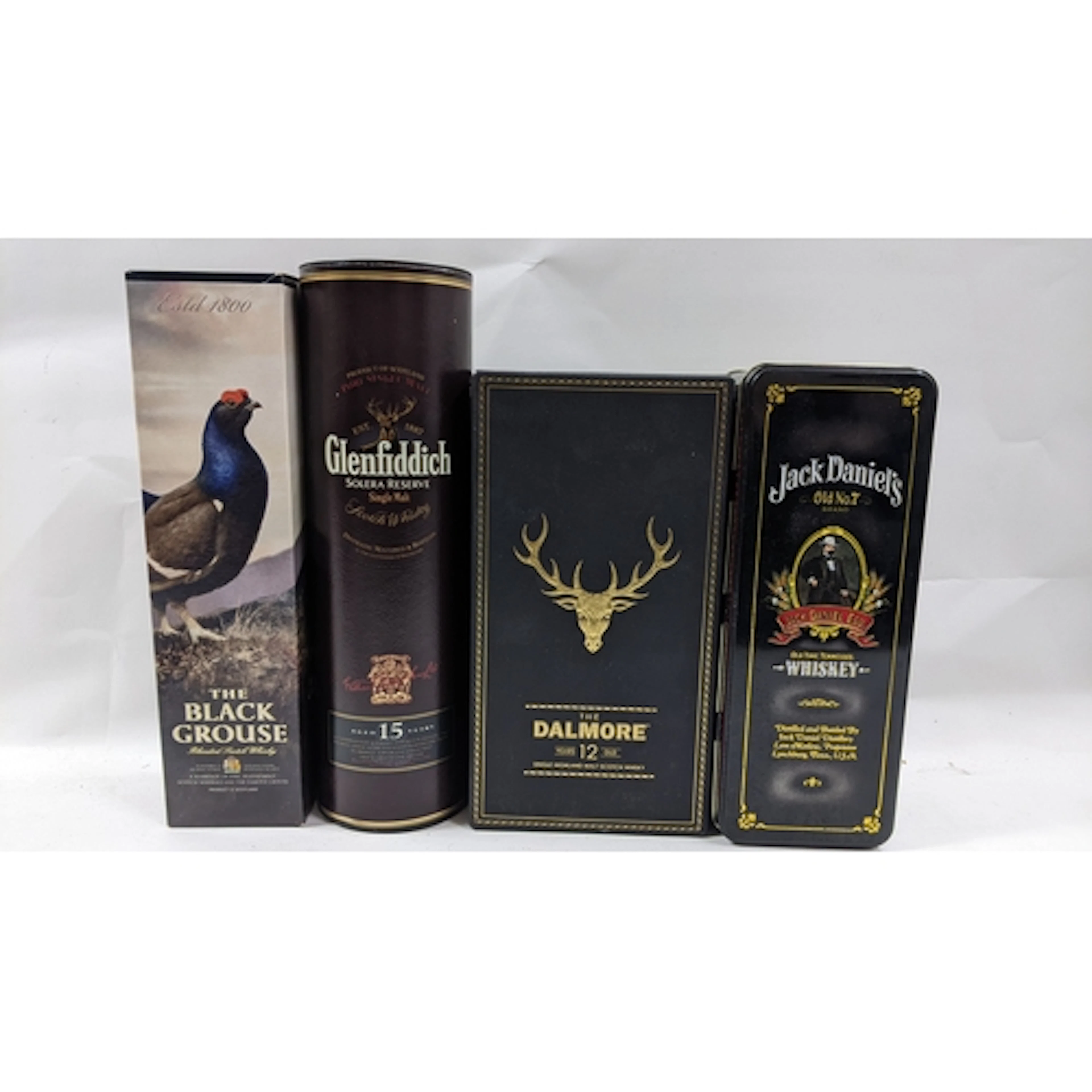 A mixed lot of four whiskies, comprising: – The Black Grouse...