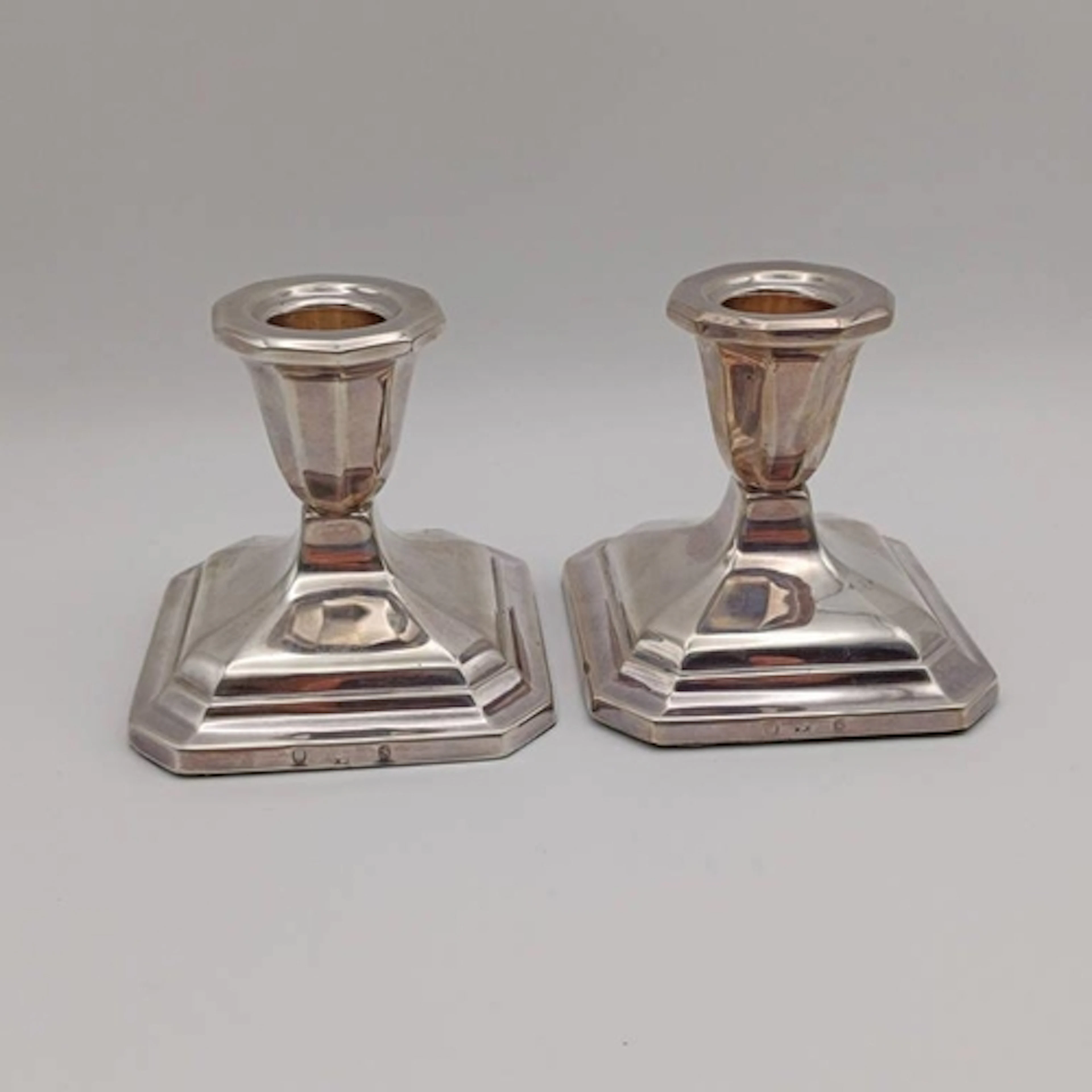 A PAIR OF DANISH SILVER DWARF CANDLESTICKS BY JOHANNES SIGGA...