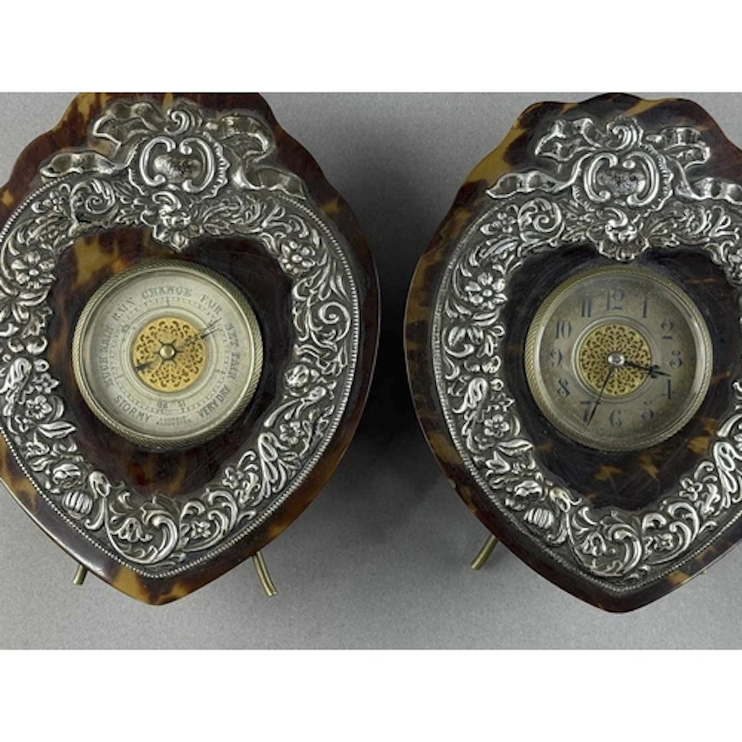 Decorative Arts: a shield shaped tortoiseshell and silver mo...