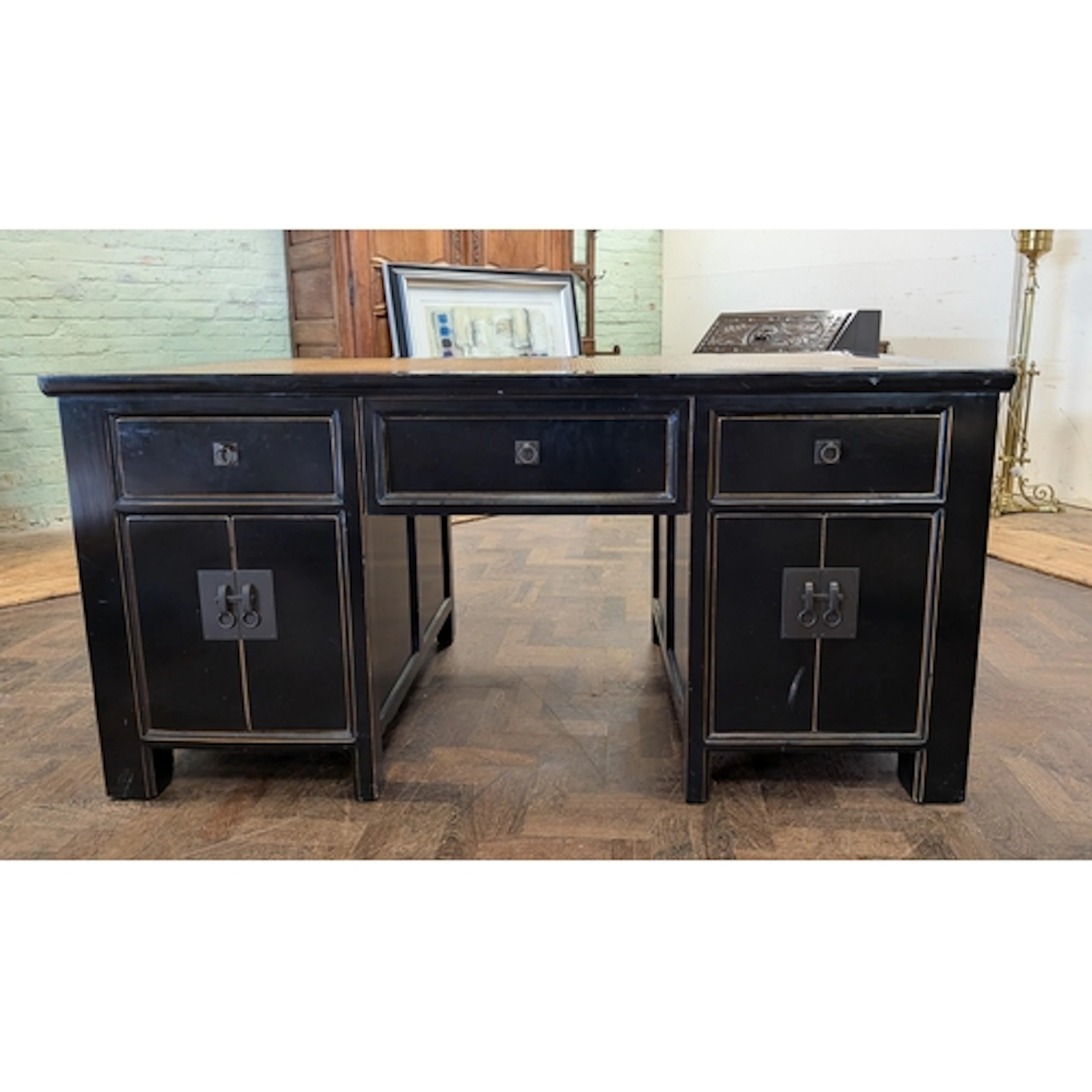 An oriental style black lacquered gilt lined double pedestal...