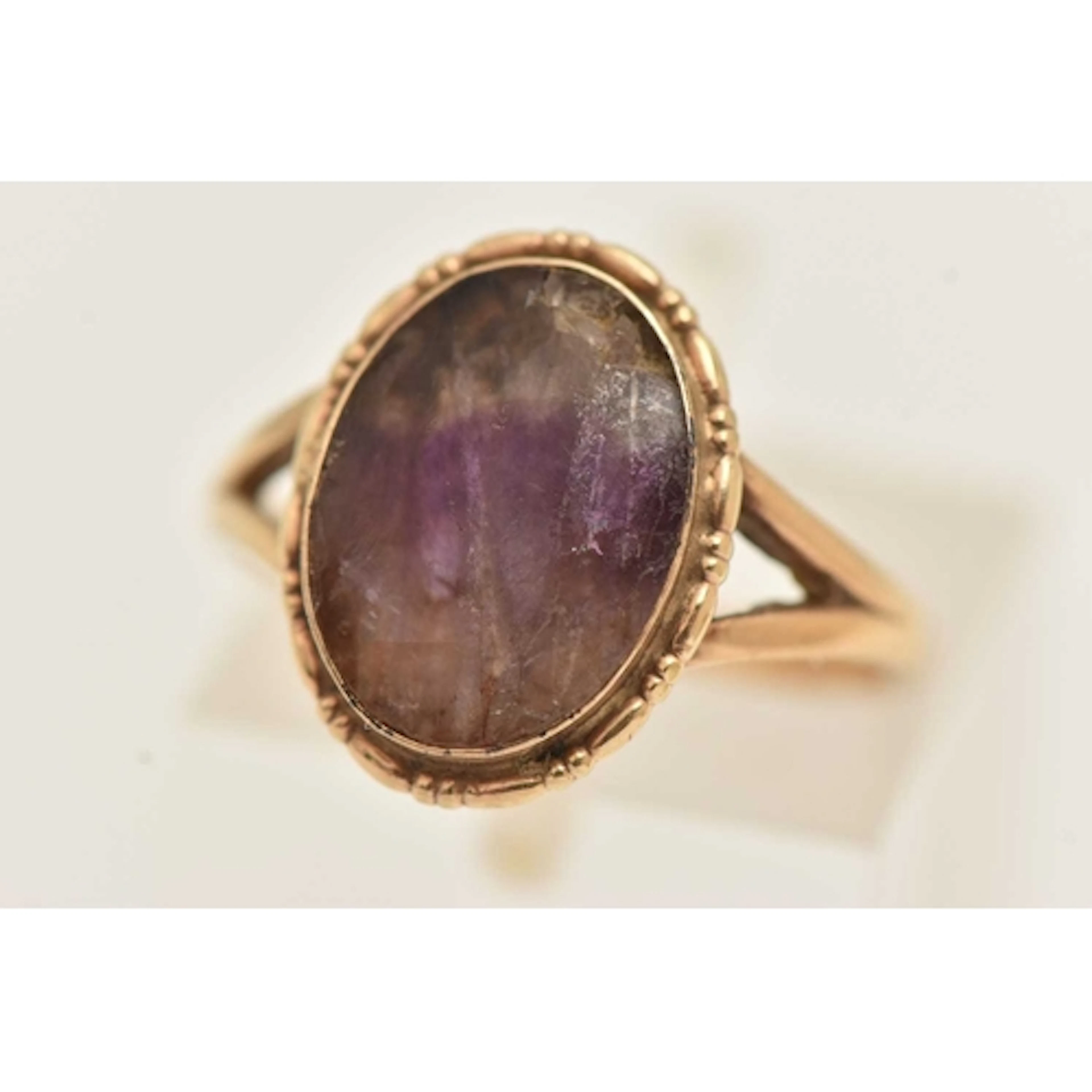 A YELLOW METAL AND BLUE JOHN RING, oval cabochon Blue John, ...