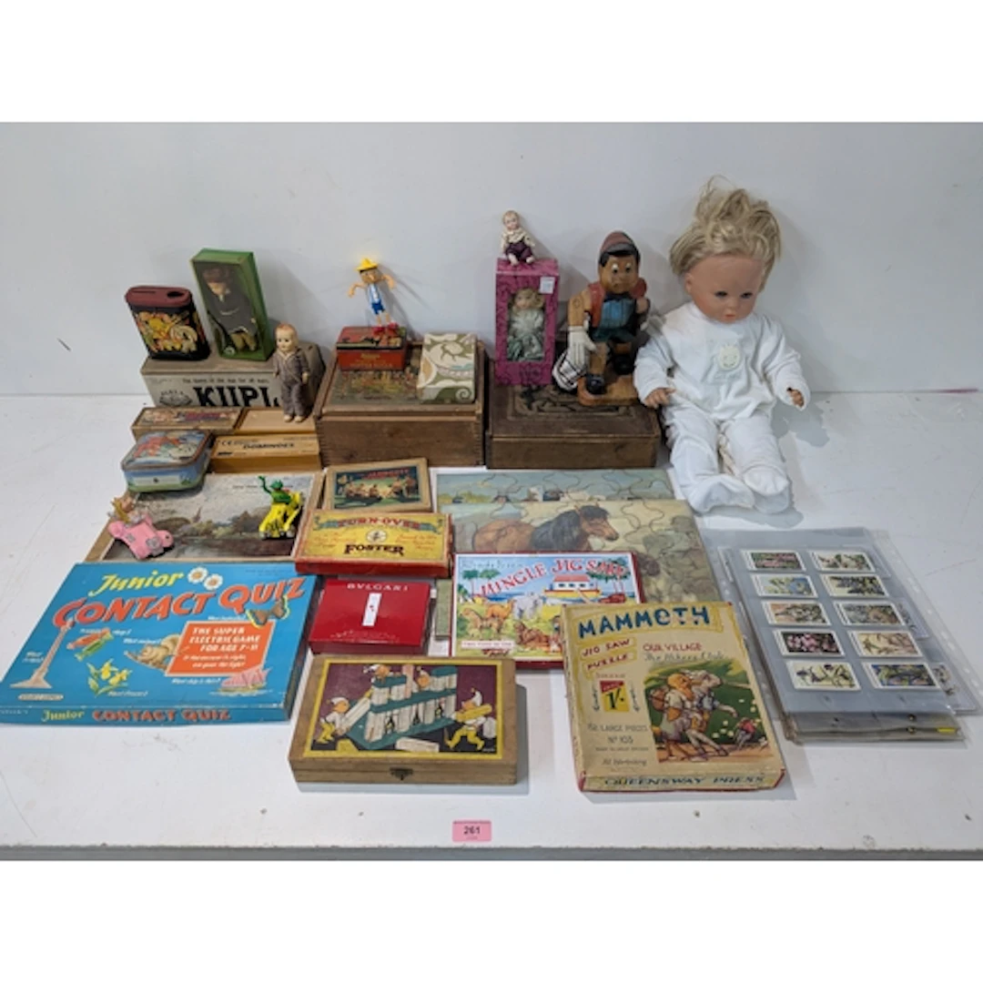 A large collection of boxed games, cigarette cards, jigsaw p...