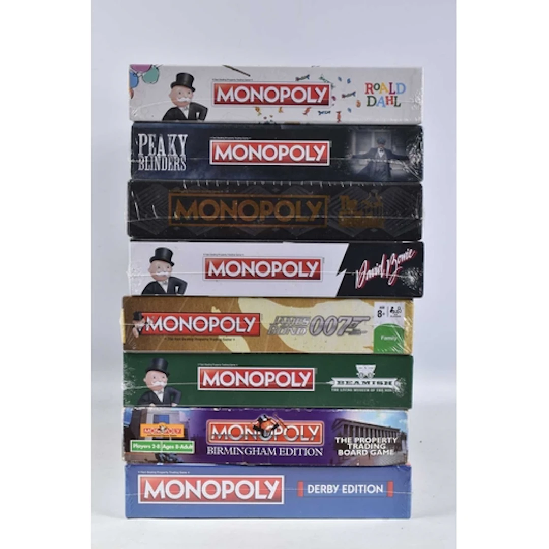 A SELECTION OF MONOPOLY BOARD GAMES, to include a factory se...
