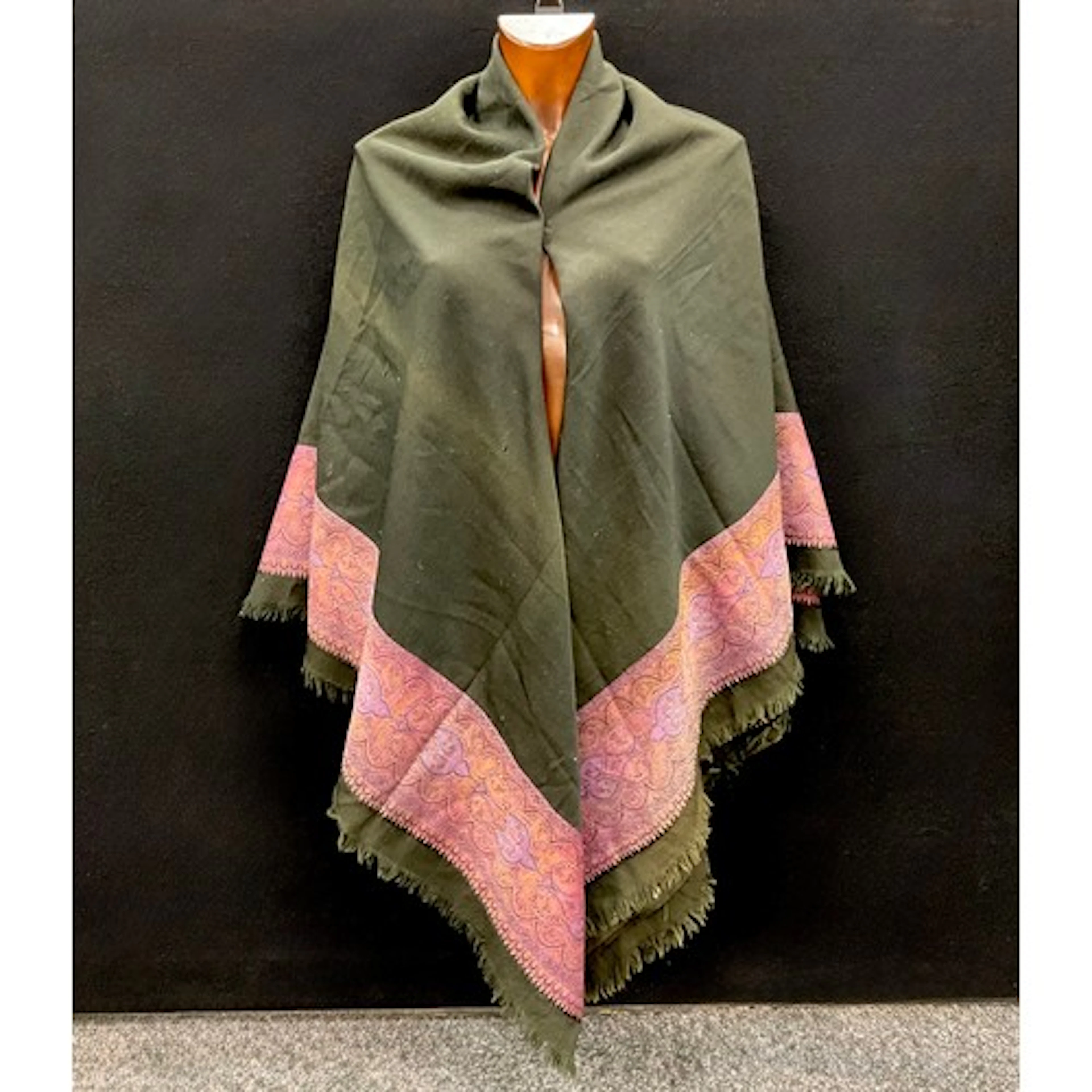 A Victorian paisley shawl, of black wool decorated to two si...