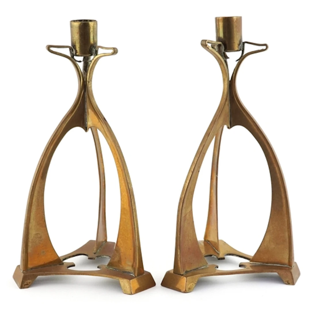 Pair of Arts & Crafts brass candlesticks, possibly designed ...