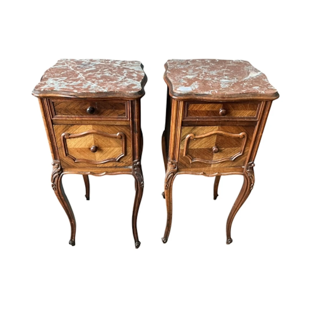 A pair of French Louis XV style marble topped walnut bedside...