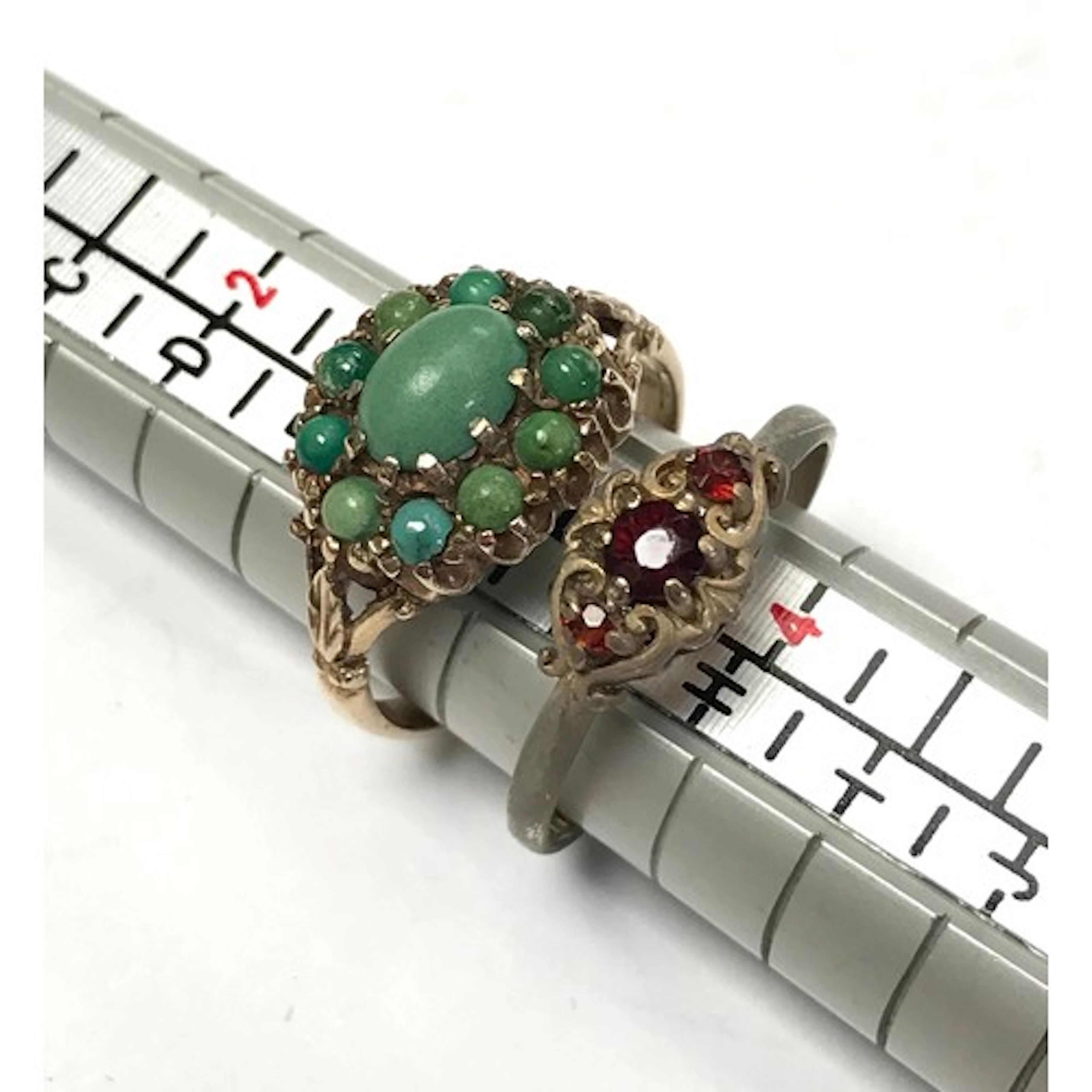 A 9ct gold turquoise cluster ring; a 9ct gold three stone ri...