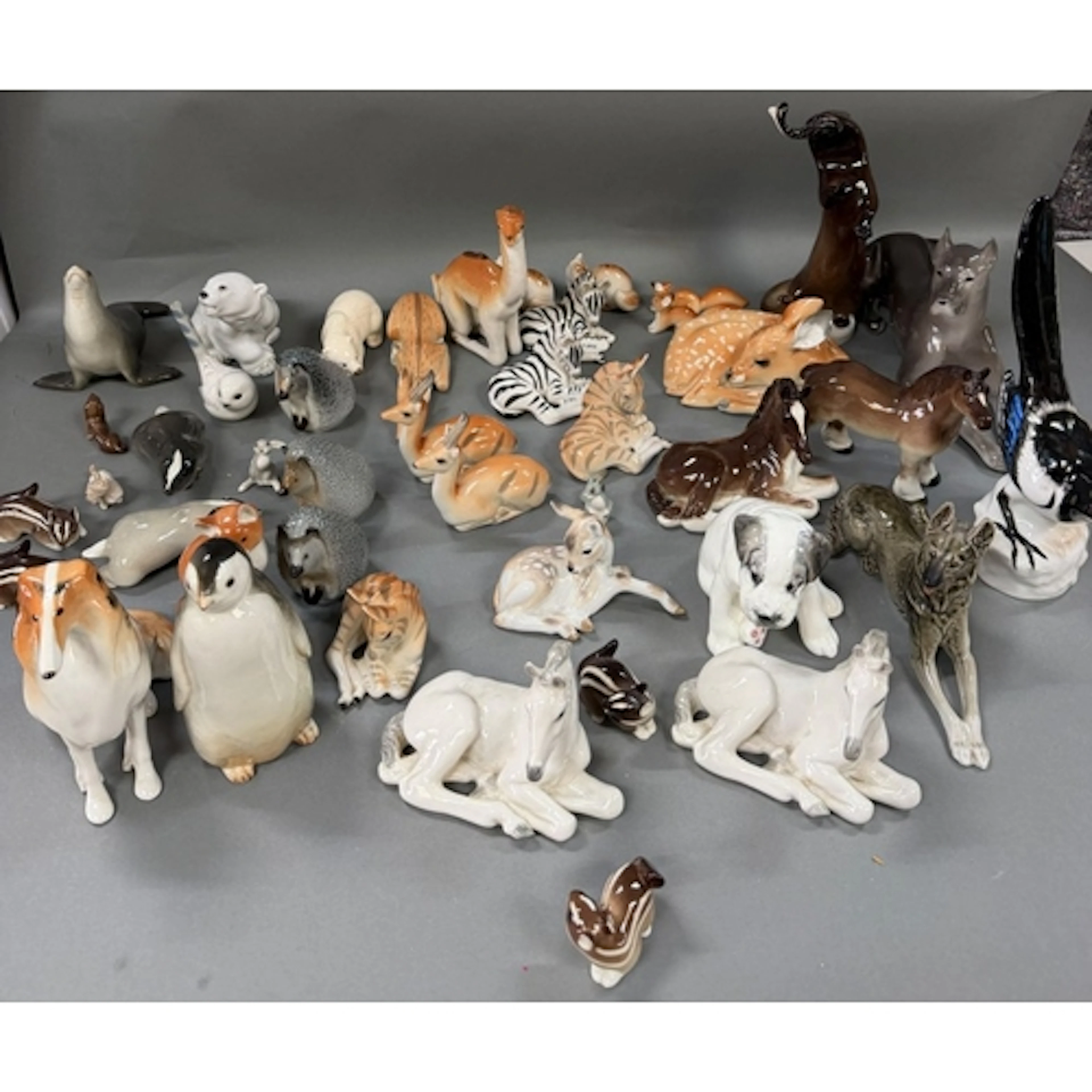A large selection of porcelain animals made and stamped in t...