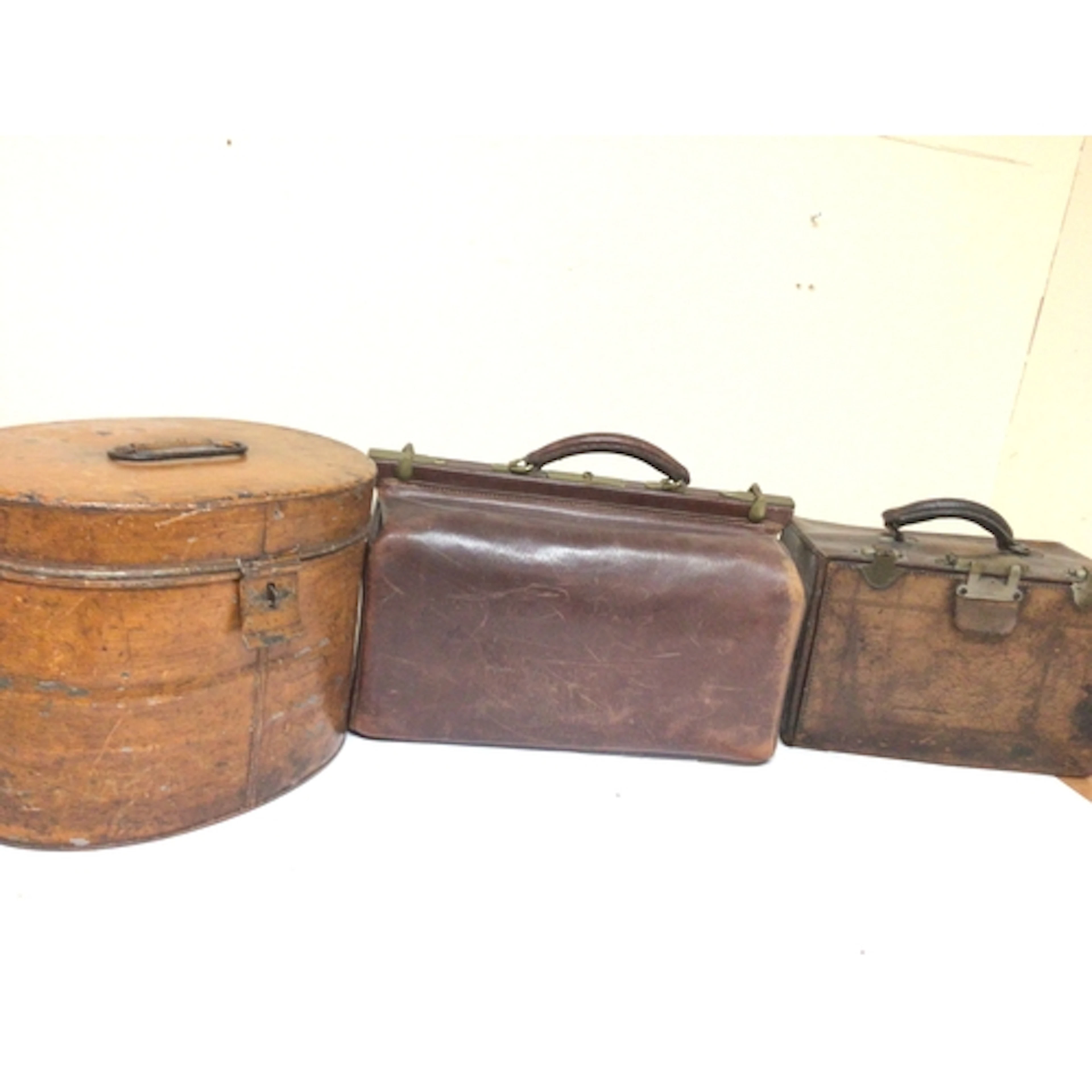 A Vintage leather Gladstone bag one other Vintage leather ca...