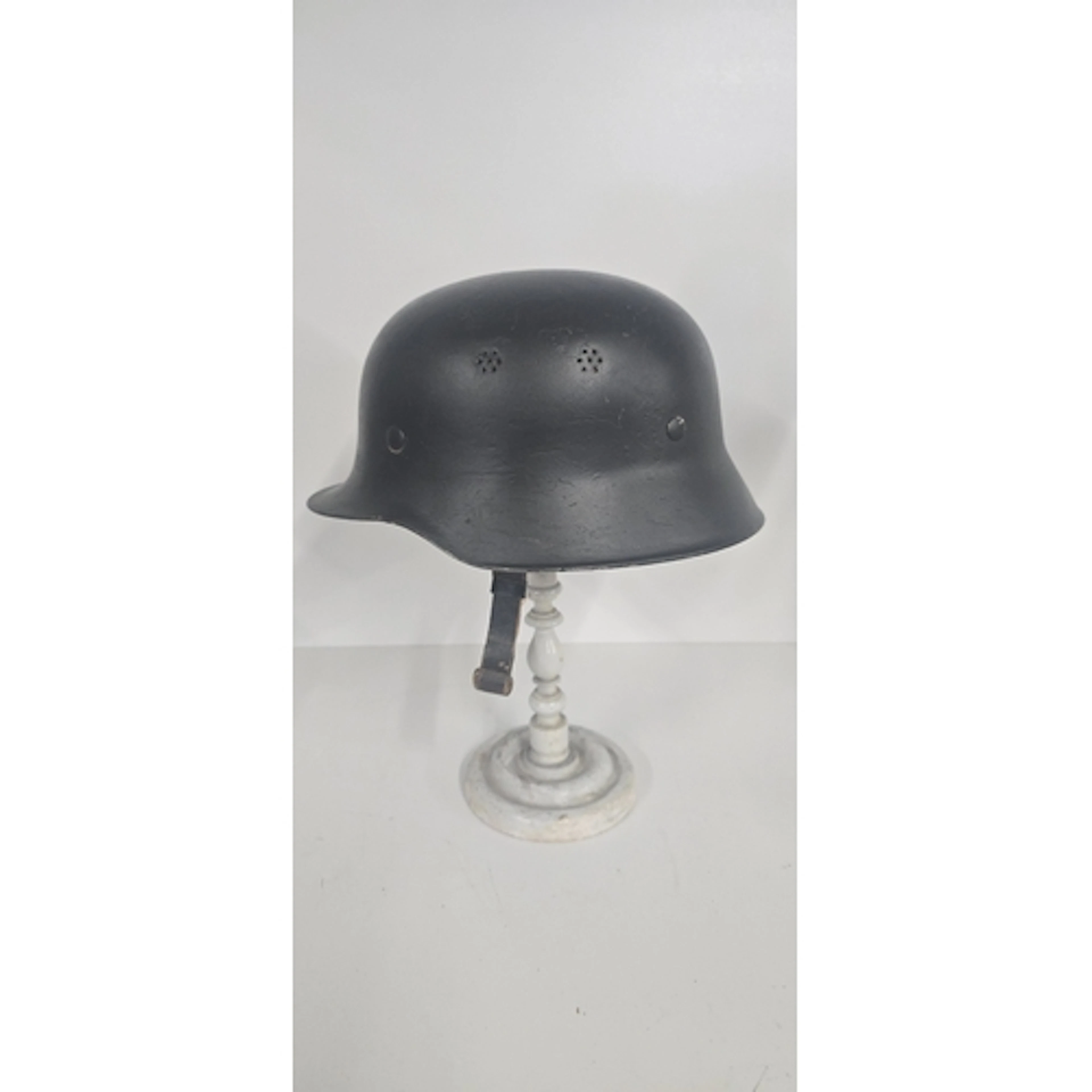 A German M34 Type steel Police Helmet, painted matt black wi...