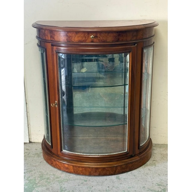 A walnut veneer Demi-lune glazed display cabinet