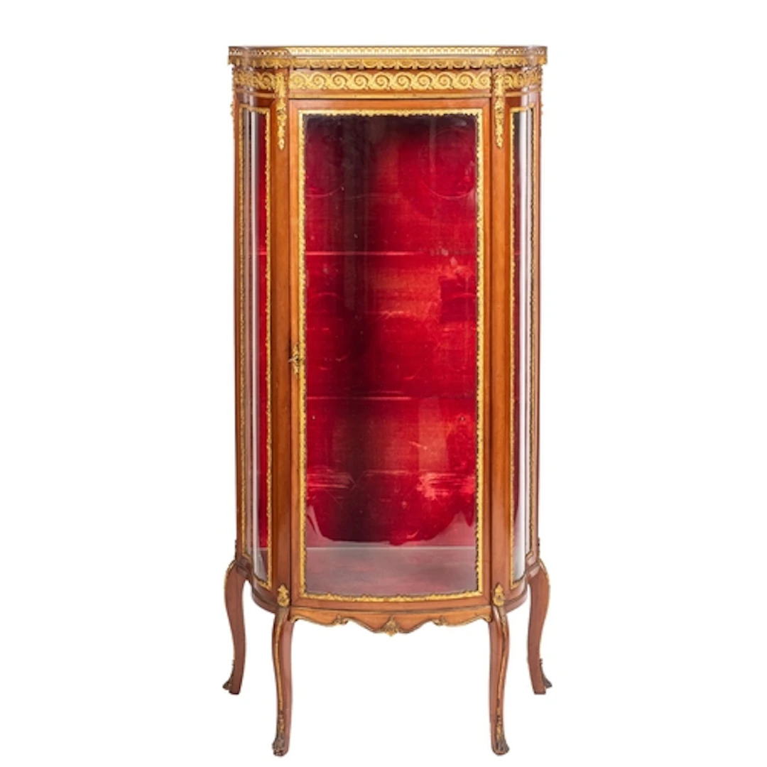 A mahogany, marble topped and gilt metal mounted vitrine in ...