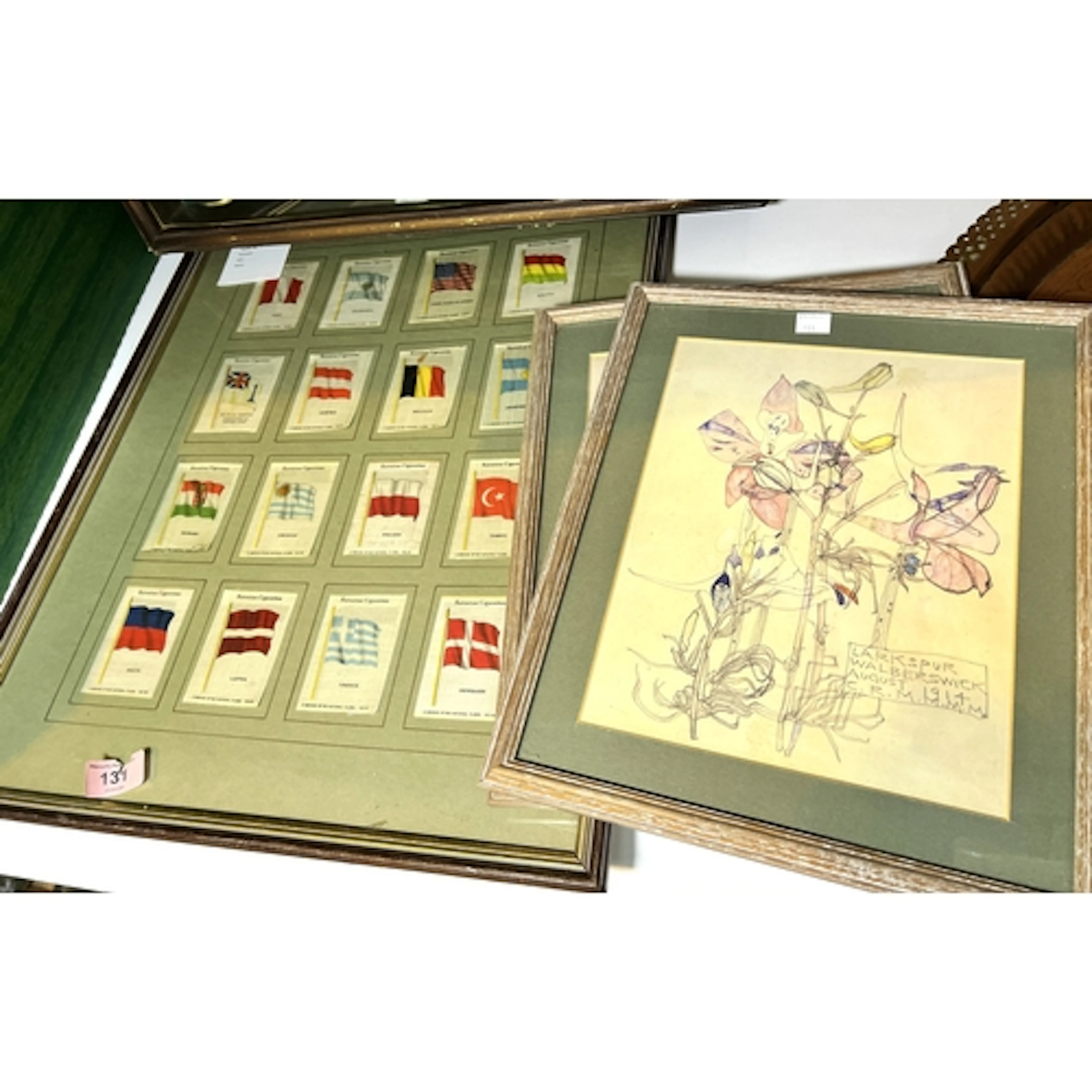 A collage of 16 framed and glazed Kensitas cigarette silks; ...