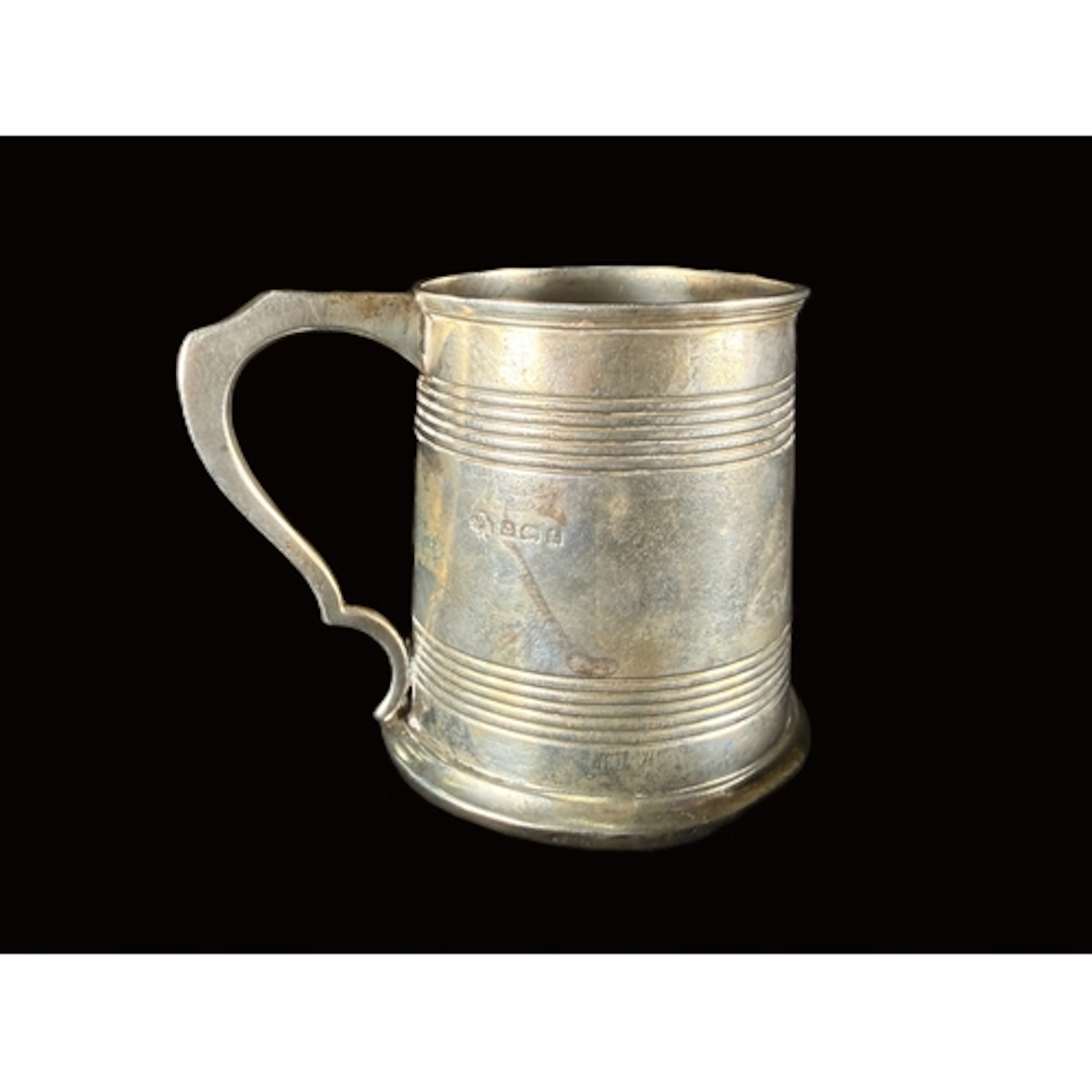 A hallmarked silver 1/2 pint mug of tapering form, with ribb...